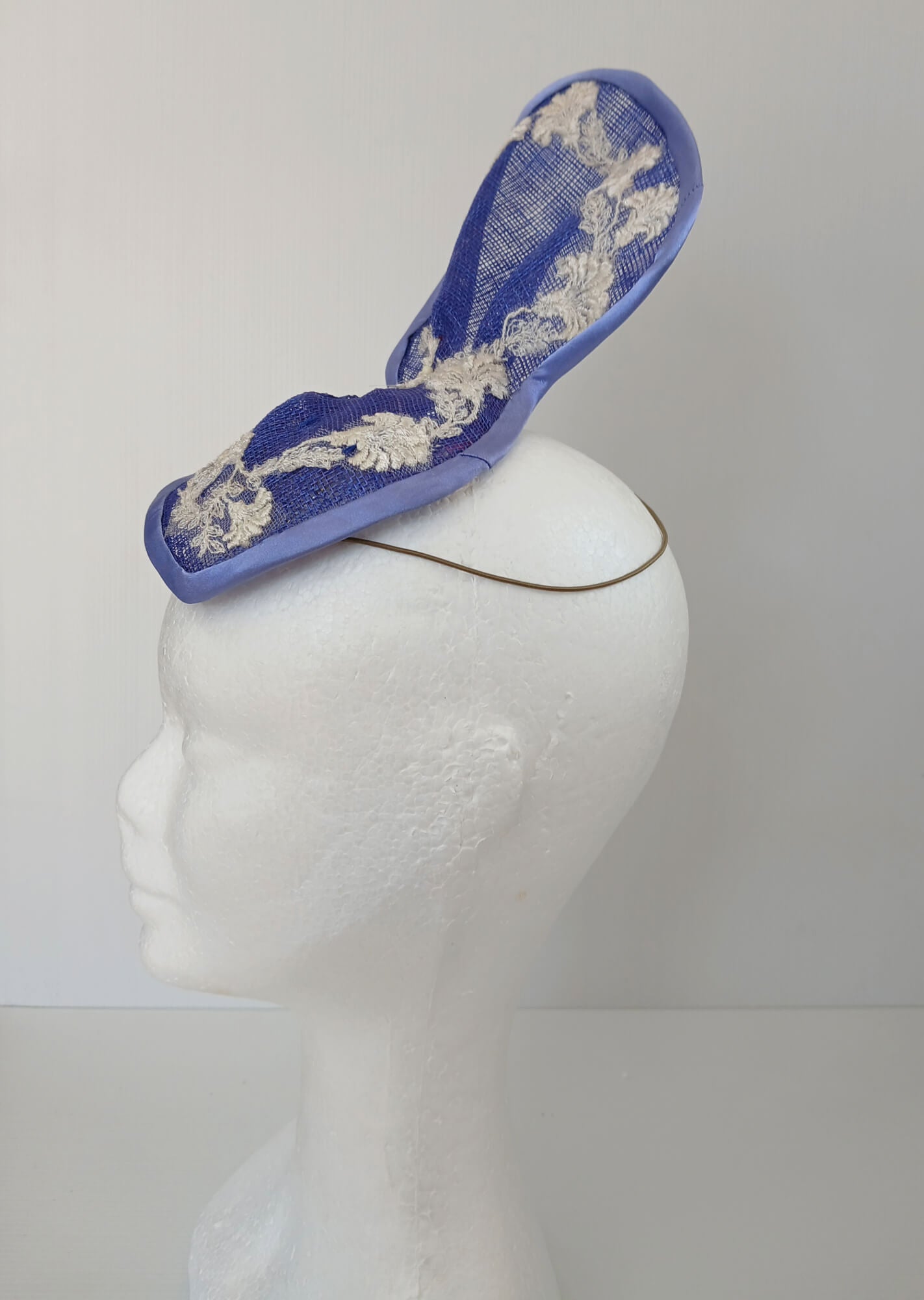 A picture of a Blue and White Sculptured Millinery Fascinator by Melissa Rath Millinery.