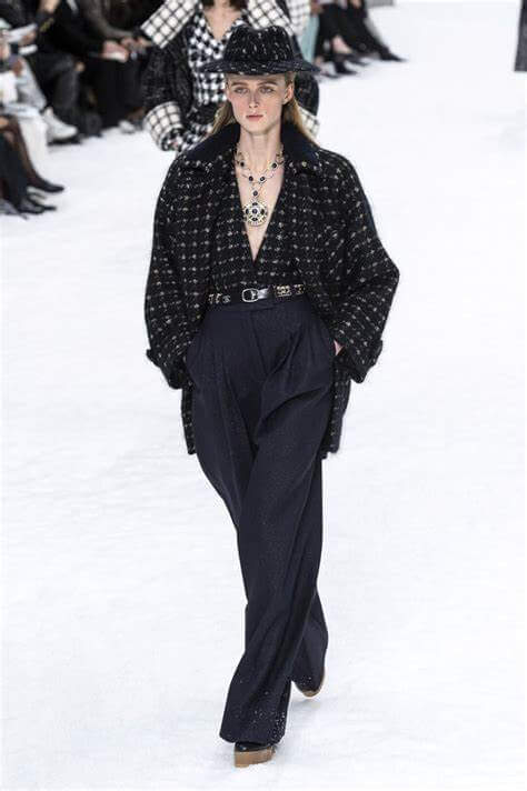 A picture of a model on the catwalk for Chanel AW 2019.