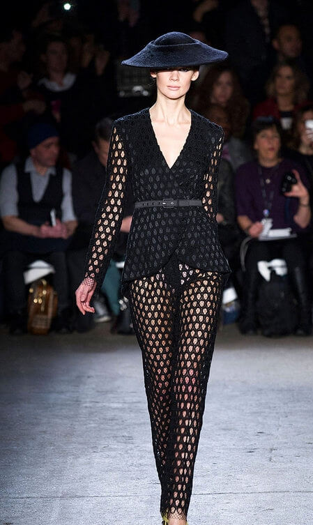 A picture of a model on the catwalk for  Christian Siriano FW 2014.