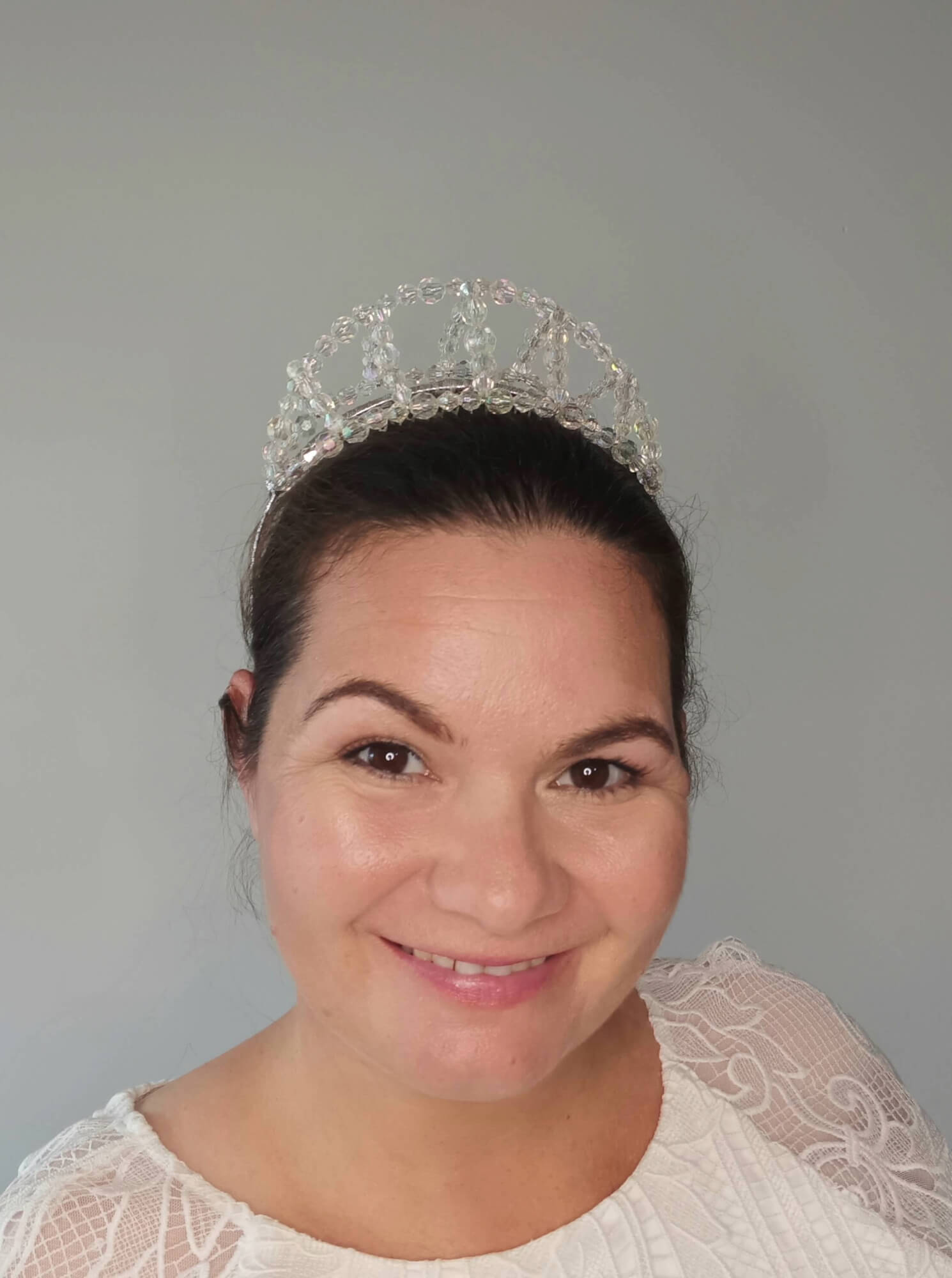 A picture of a Clear Plastic Beaded Millinery Crown by Melissa Rath Millinery.