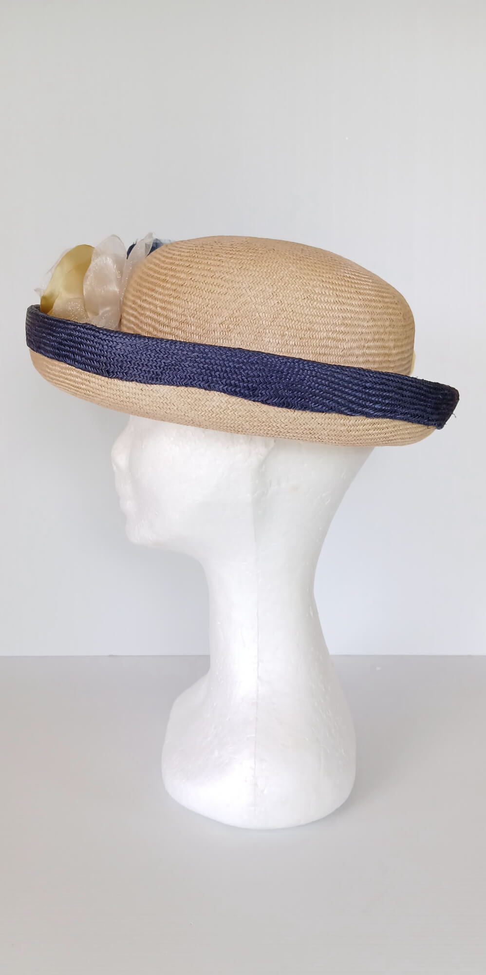 A picture of a Navy and Cream Parisisal Picture Hat by Melissa Rath Millinery.