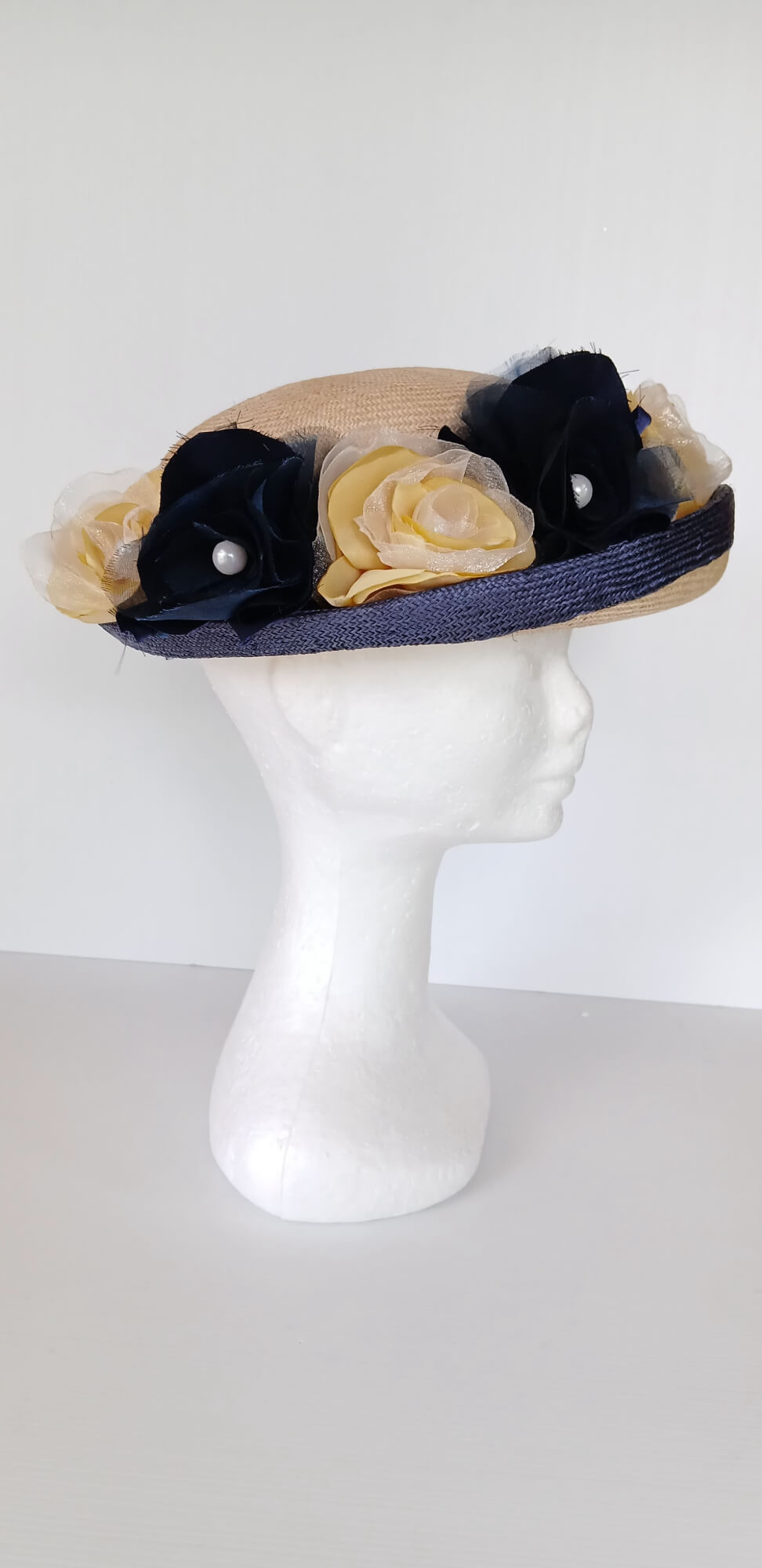 A picture of a Navy and Cream Parisisal Picture Hat by Melissa Rath Millinery.