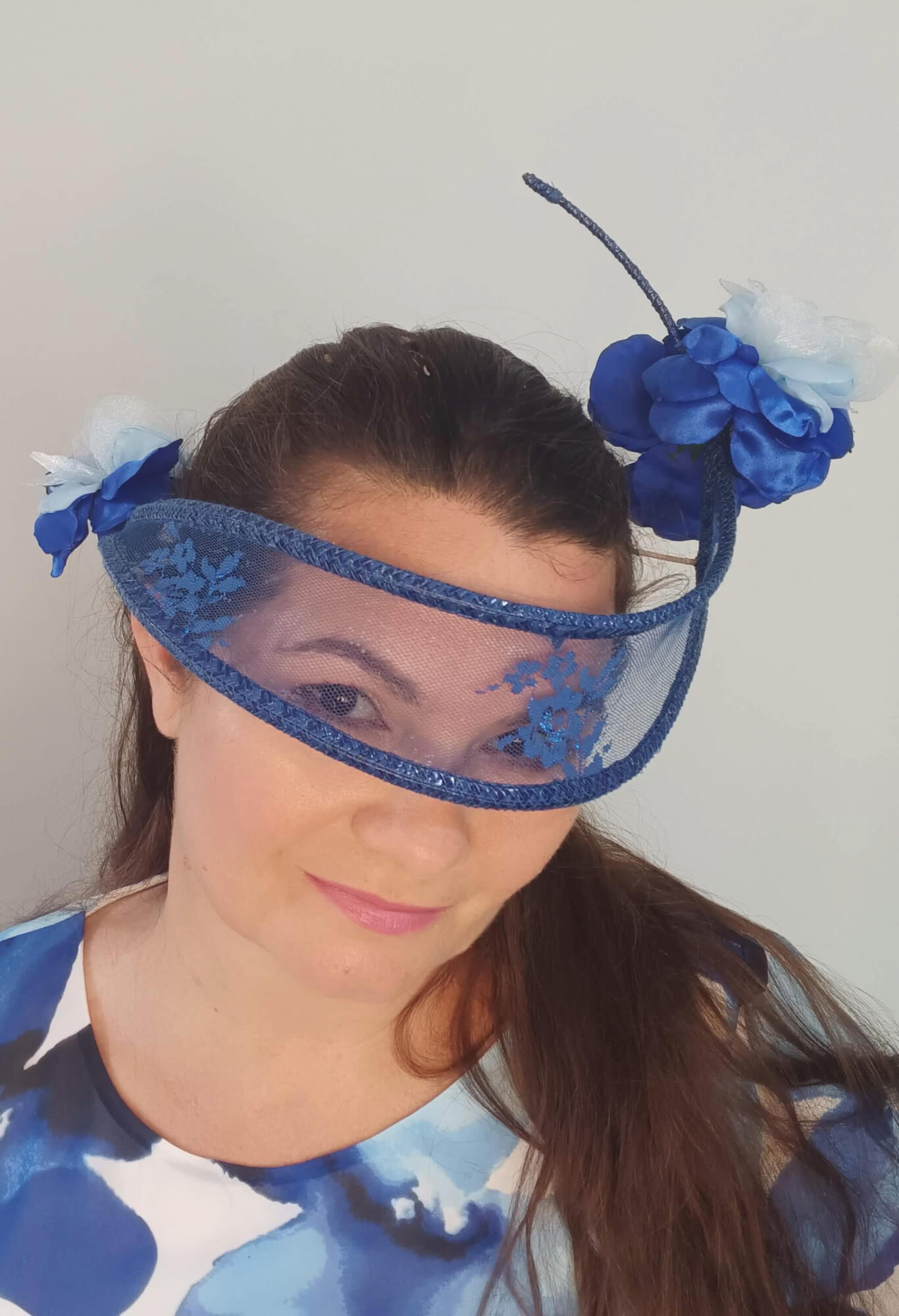 A picture of a Blue Lace Floating Millinery Headpiece by Melissa Rath Millinery.