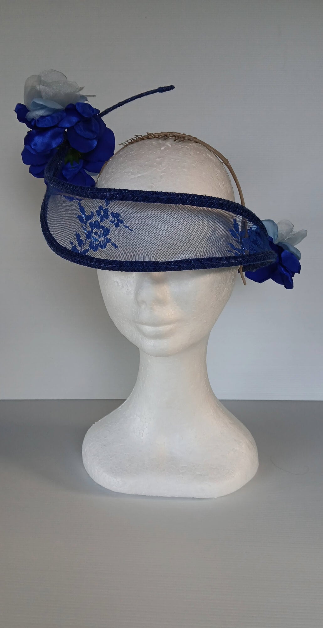 A picture of a Blue Lace Floating Millinery Headpiece by Melissa Rath Millinery.