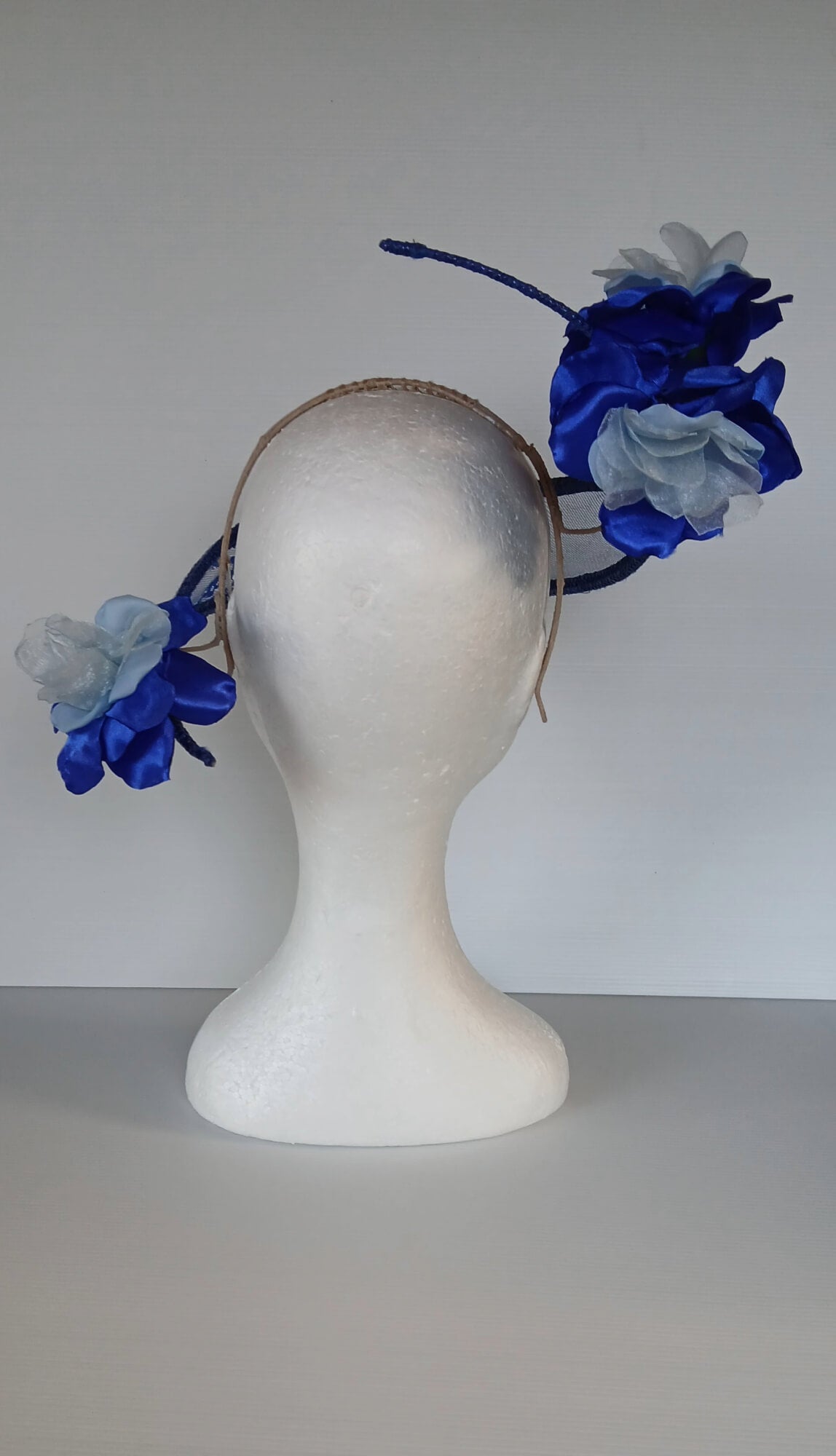 A picture of a Blue Lace Floating Millinery Headpiece by Melissa Rath Millinery.