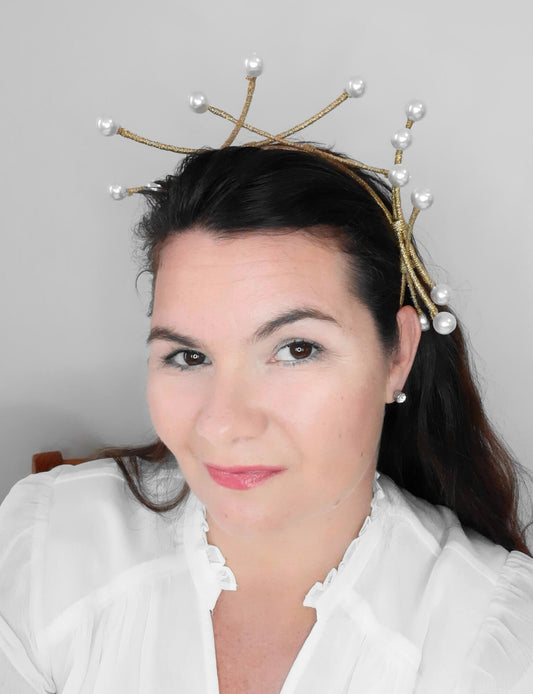 A picture of a dark gold beaded millinery headband by Melissa Rath Millinery.