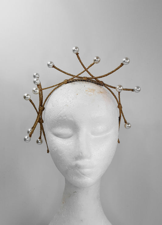 A picture of a dark gold beaded millinery headband by Melissa Rath Millinery.