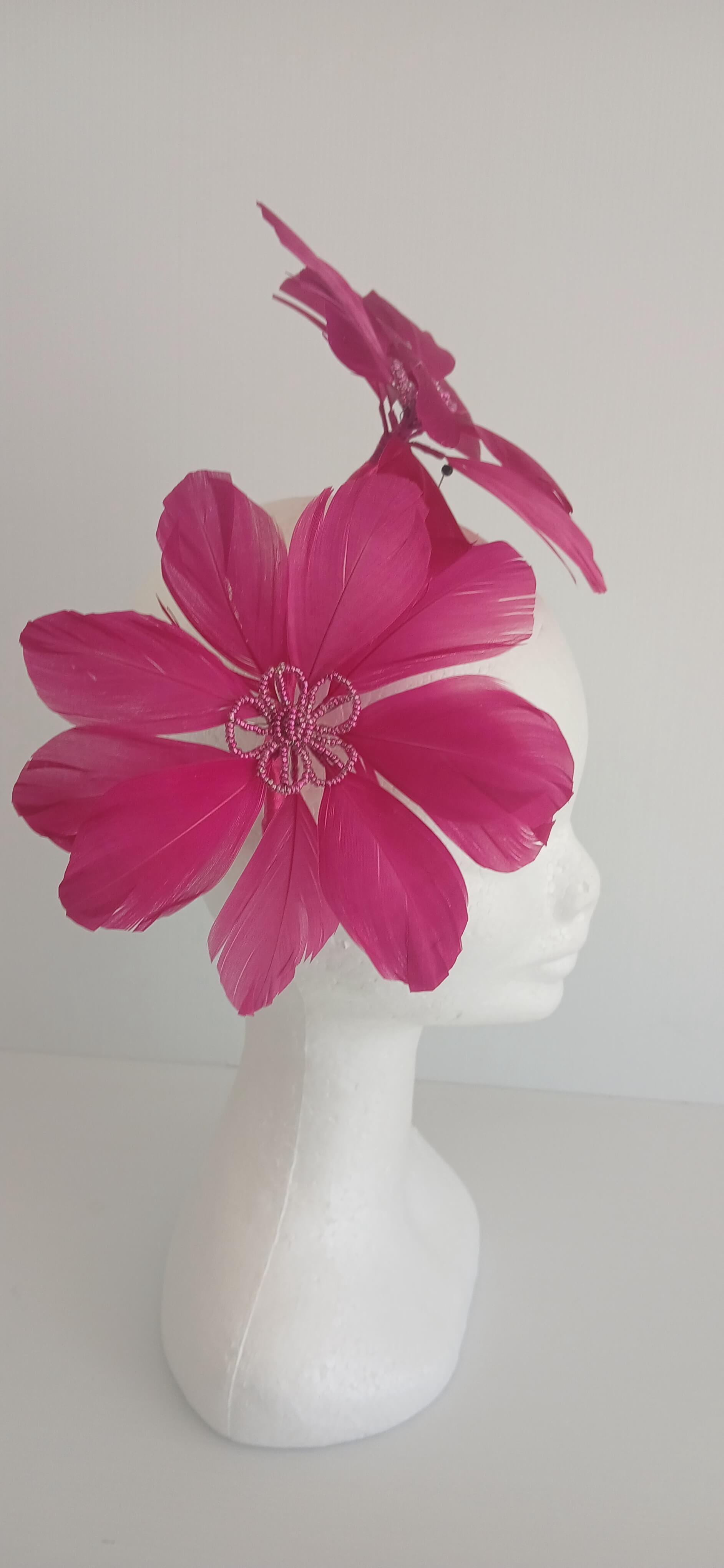 An image of the Dark Pink Feather Flower Headband by Melissa Rath Millinery