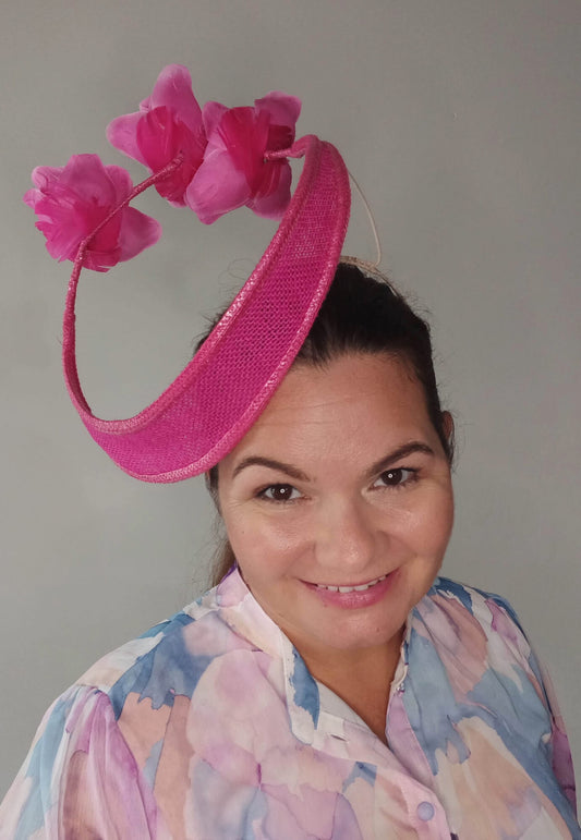 A picture of a Pink Floating Millinery Headpiece by Melissa Rath Millinery.