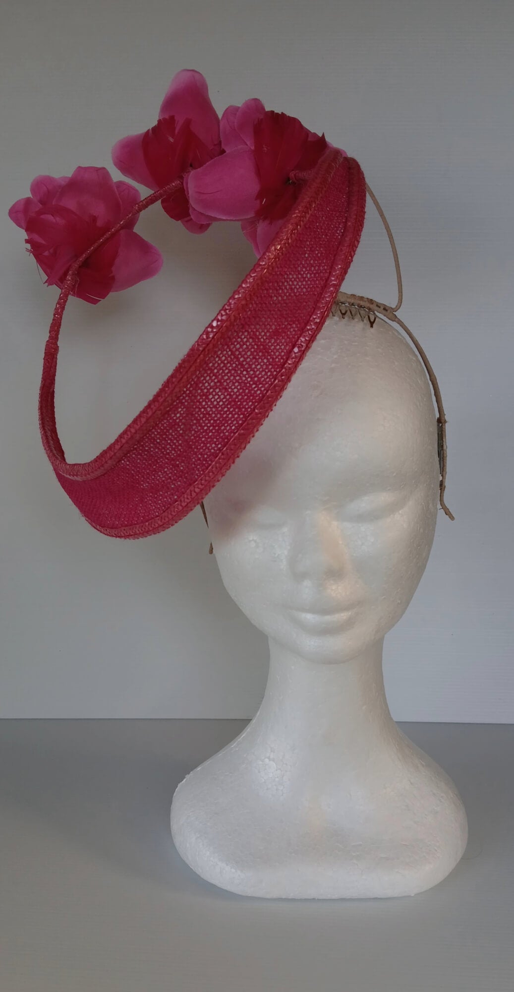 A picture of a Pink Floating Millinery Headpiece by Melissa Rath Millinery.
