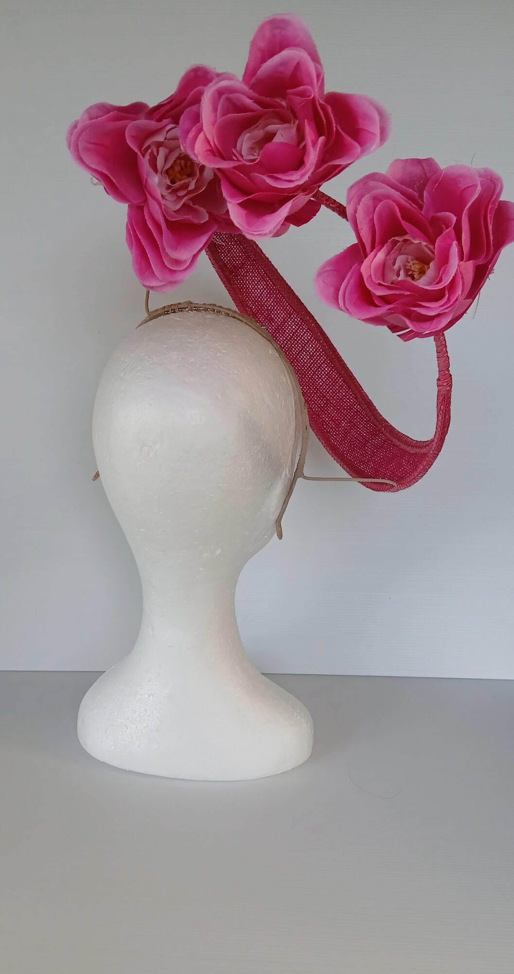 A picture of a Pink Floating Millinery Headpiece by Melissa Rath Millinery.