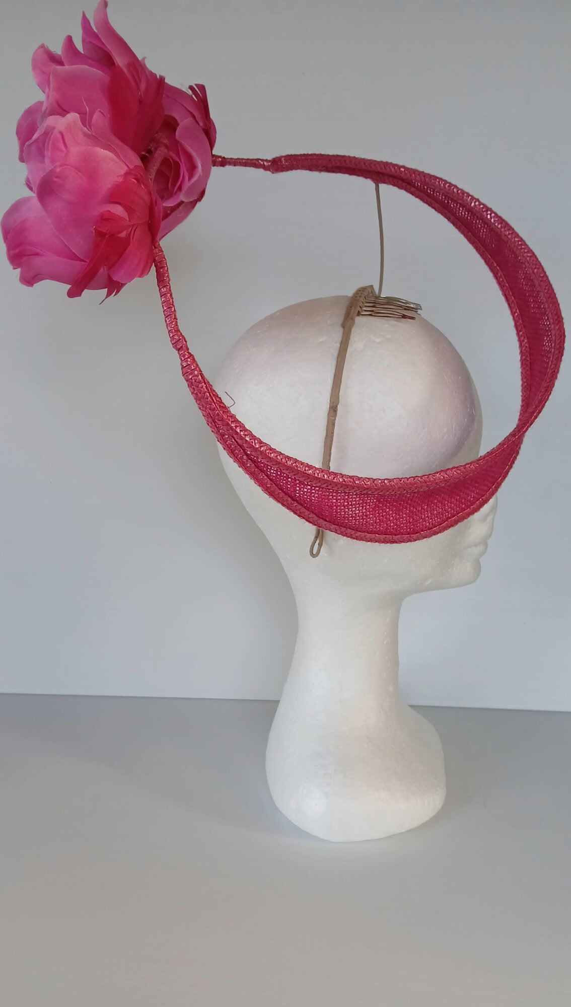 A picture of a Pink Floating Millinery Headpiece by Melissa Rath Millinery.