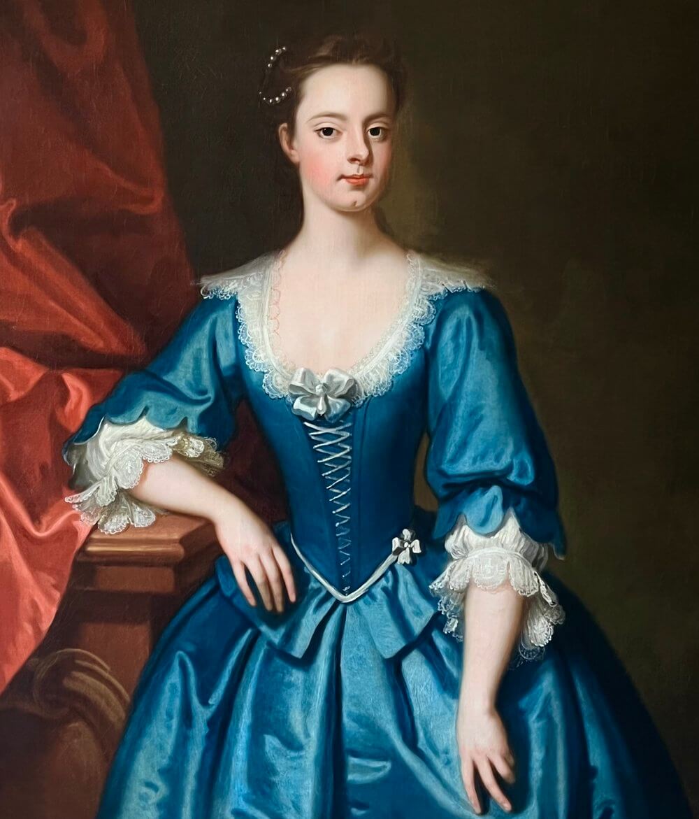 A painting by Enoch Seeman of a lady named  Judith Morice, wearing a blue silk gown in the 18th Century