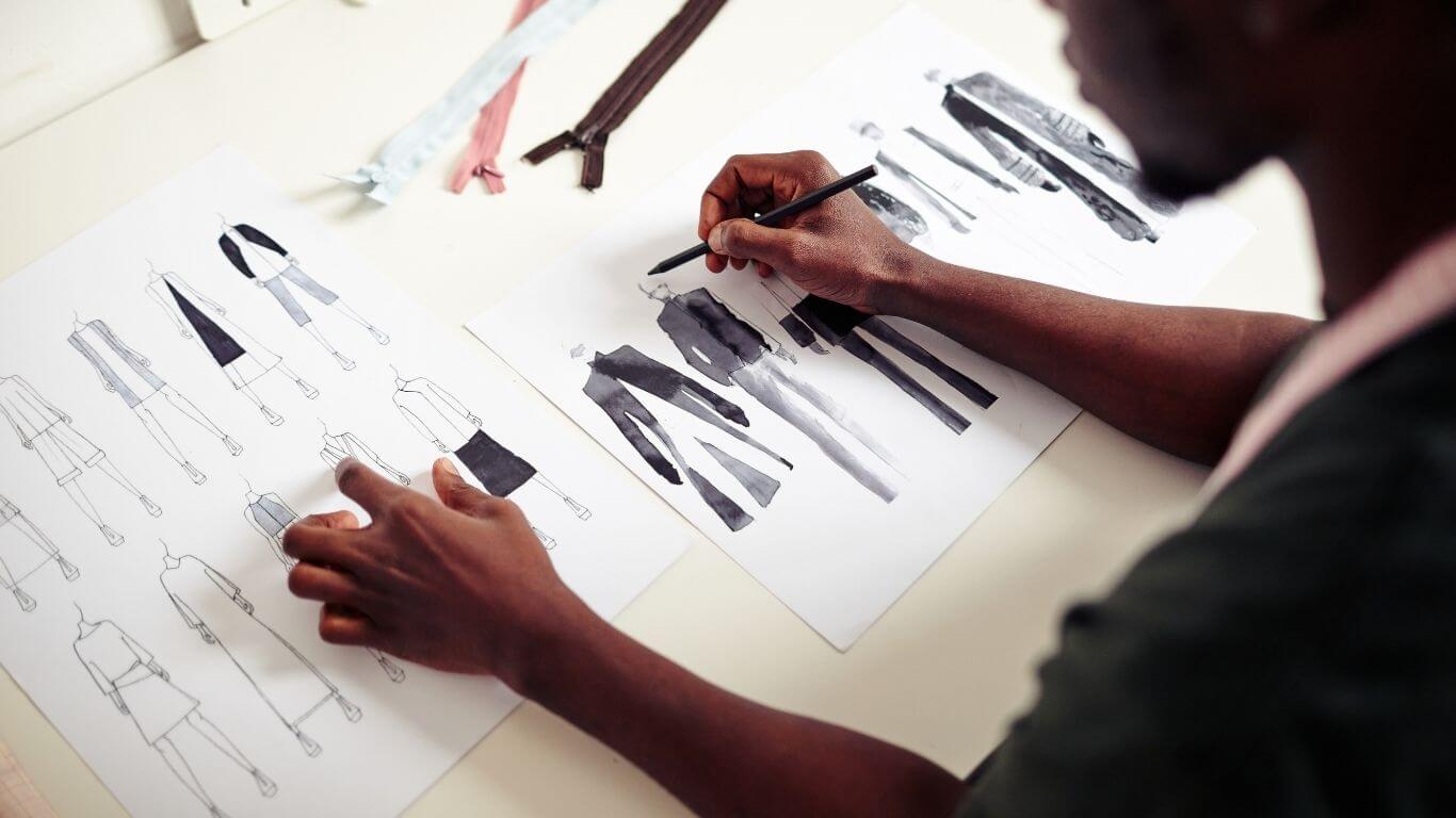 An image of a designer drawing fashion designs.