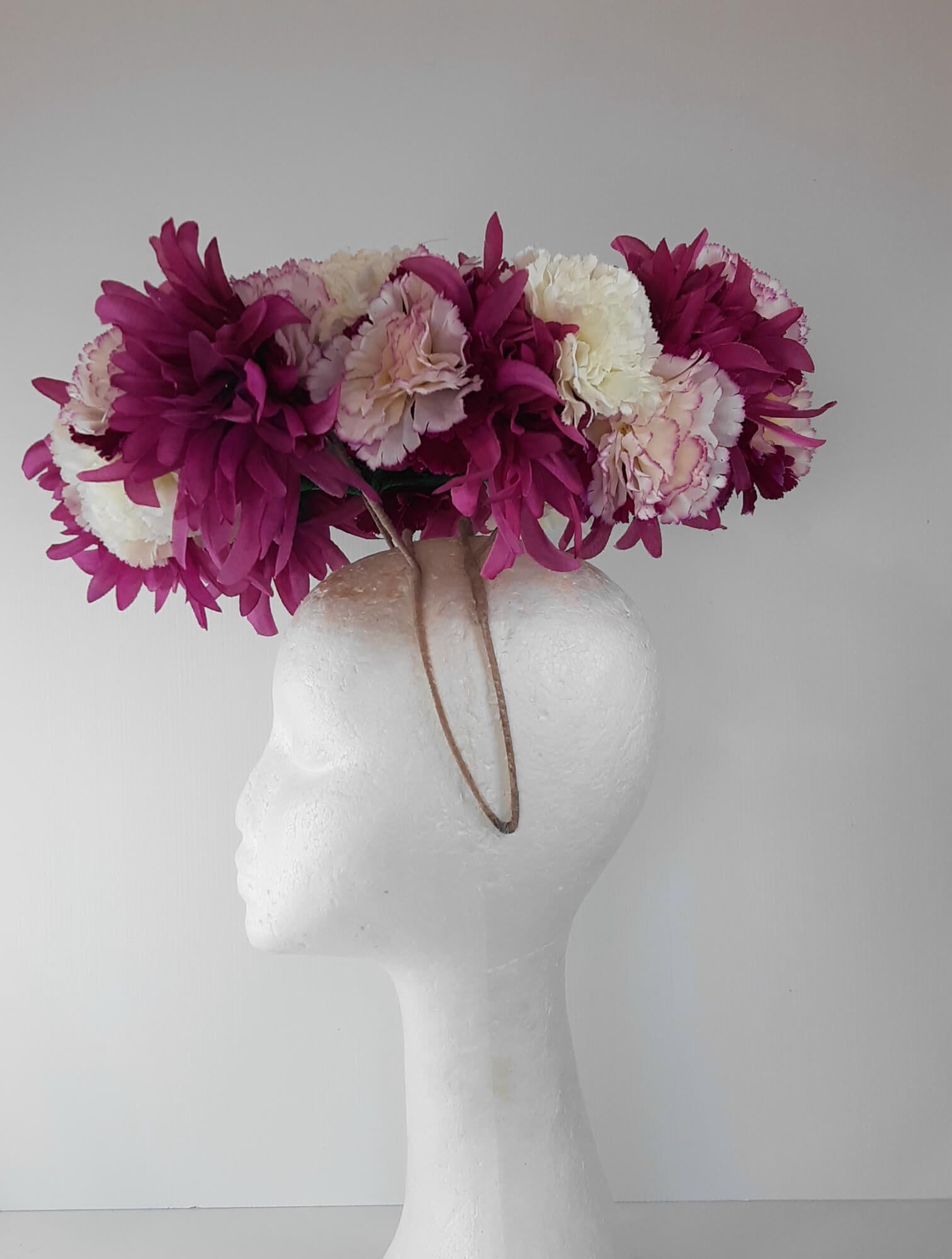 A picture of a floral floating millinery halo by Melissa Rath Millinery. 