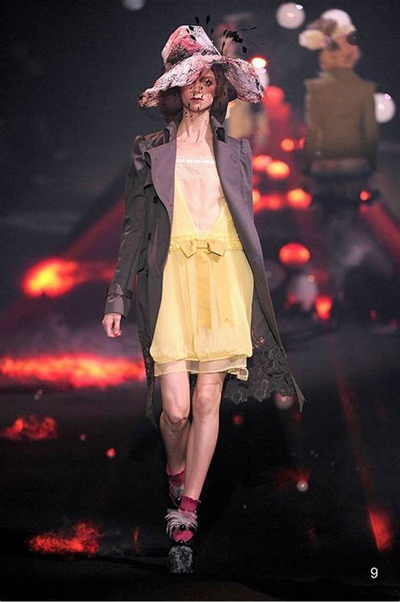 A picture of a model on the catwalk for Galliano SS 2010.