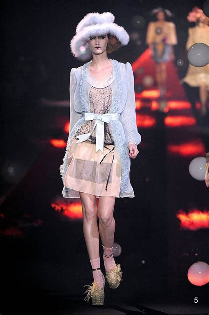 A picture of a model on the catwalk for Galliano SS 2010.