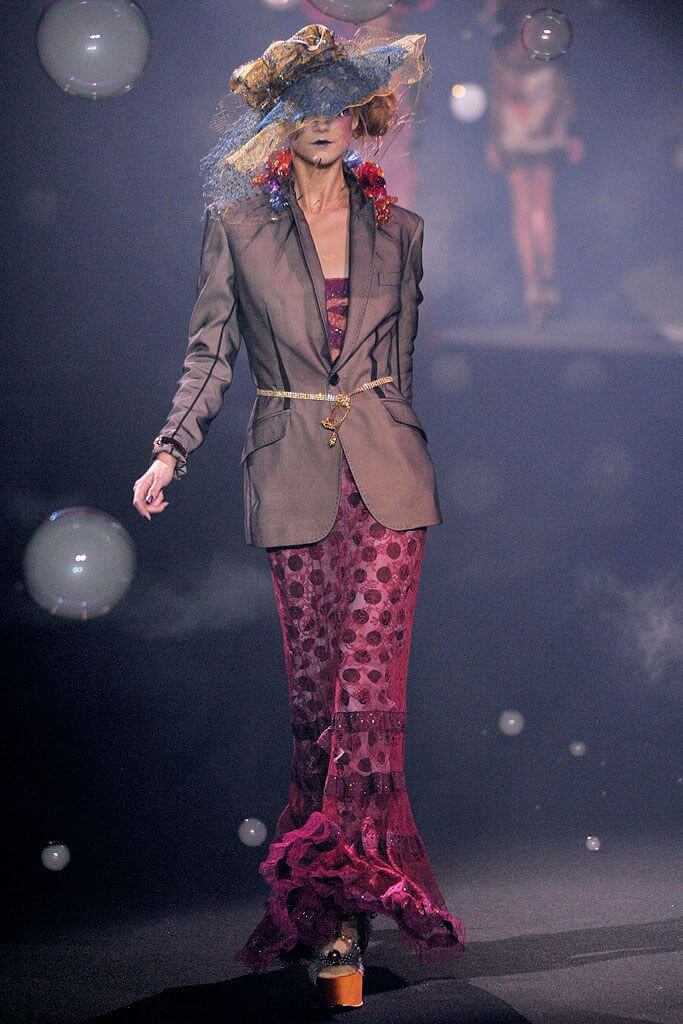 A picture of a model on the catwalk for Galliano SS 2010.