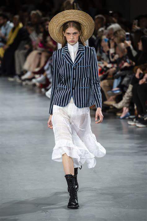 A picture of a model on the catwalk for Galliano SS 2019.