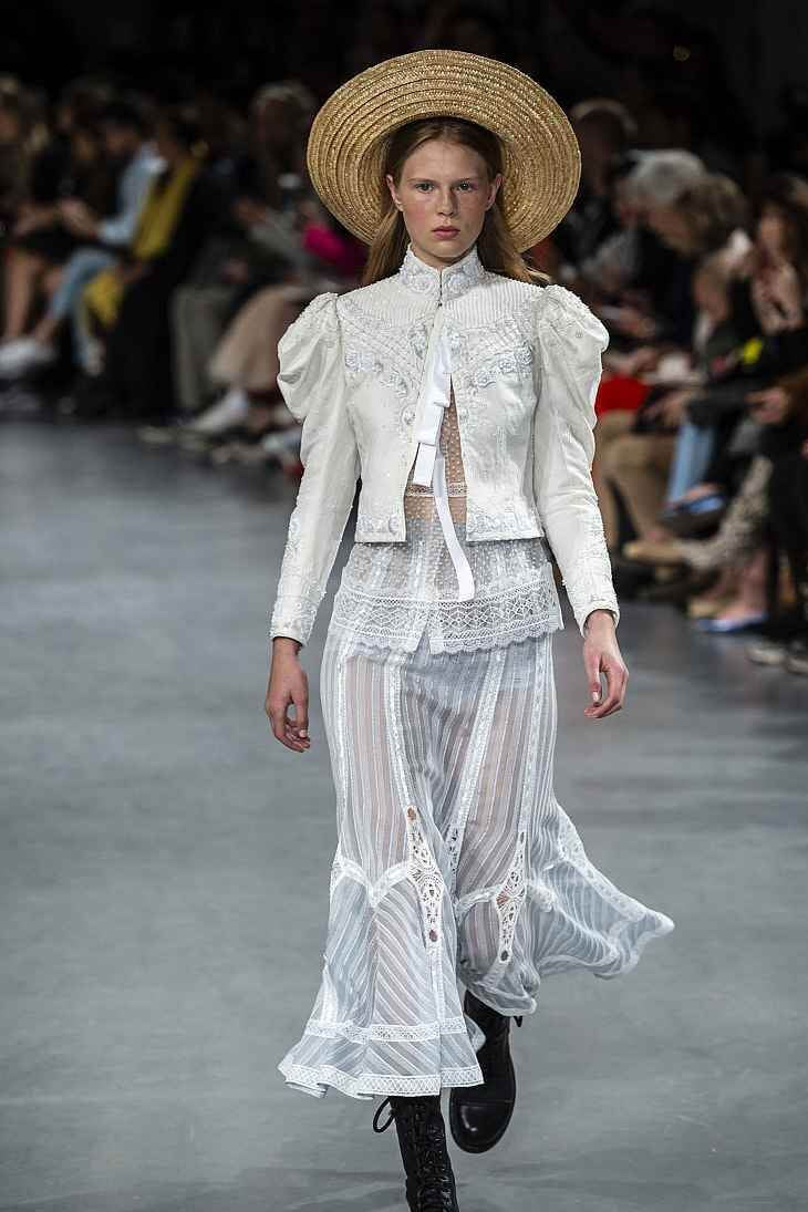 A picture of a model on the catwalk for Galliano SS 2019.