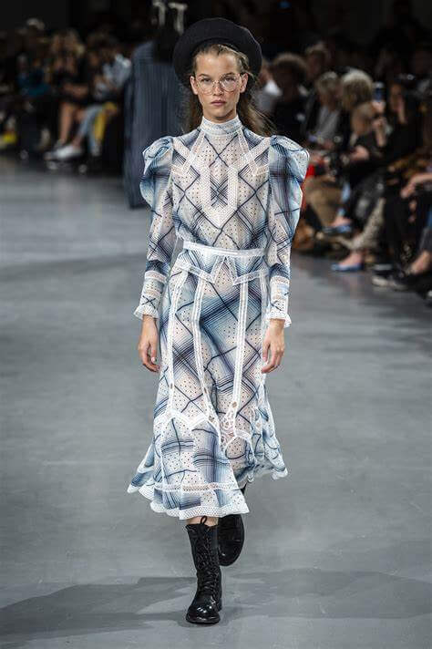 A picture of a model on the catwalk for Galliano SS 2019.