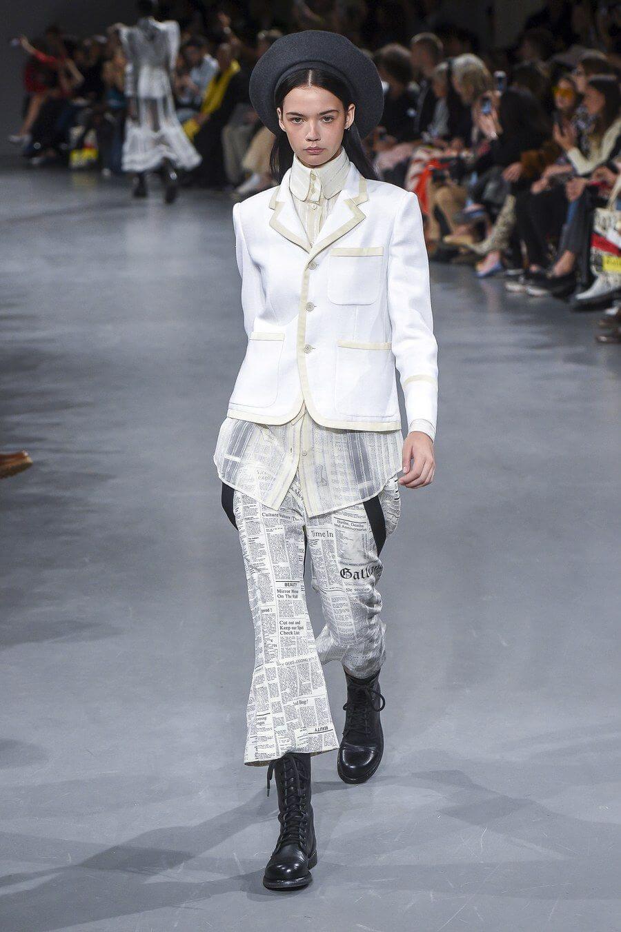 A picture of a model on the catwalk for Galliano SS 2019.