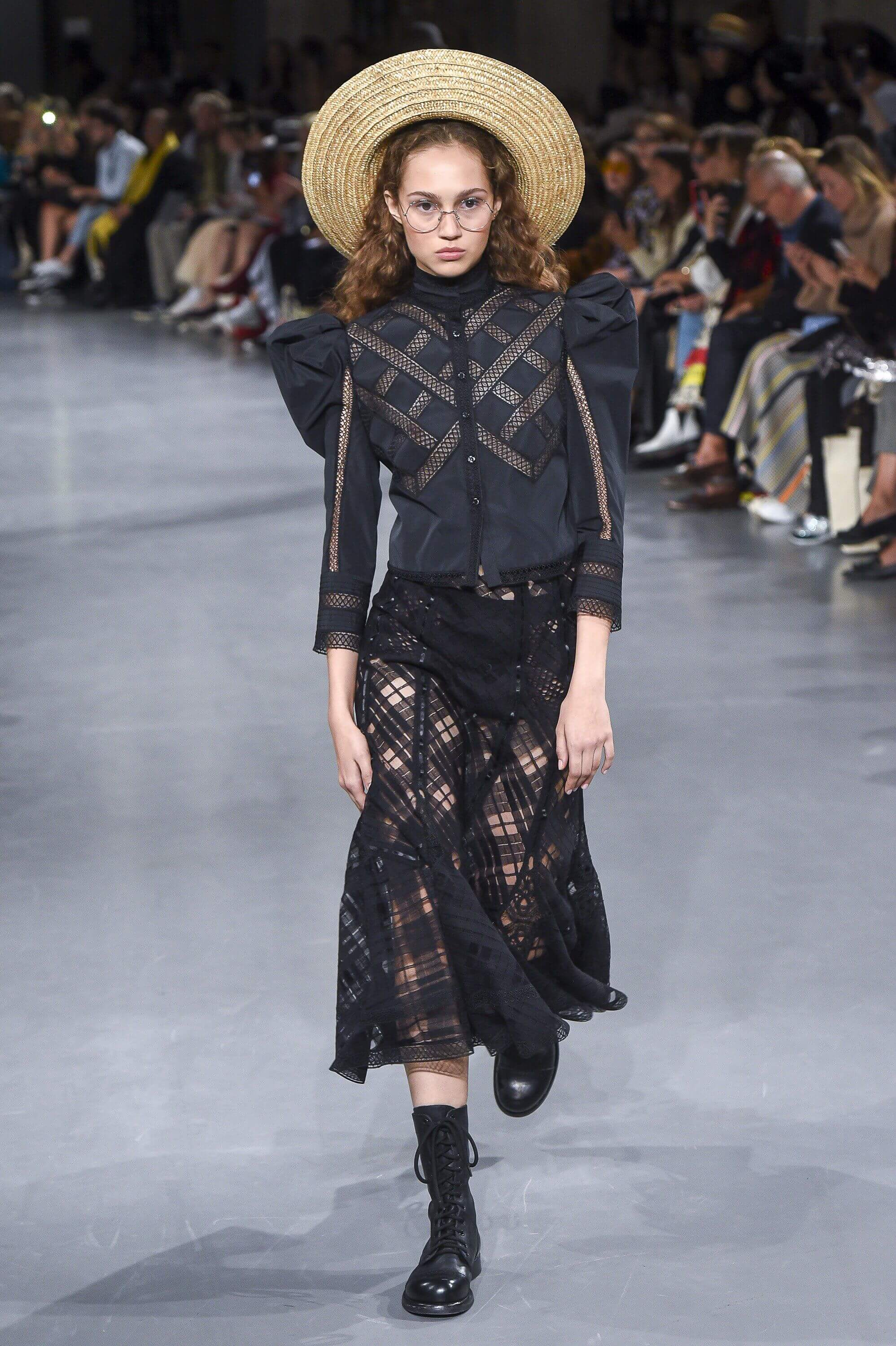 A picture of a model on the catwalk for Galliano SS 2019.