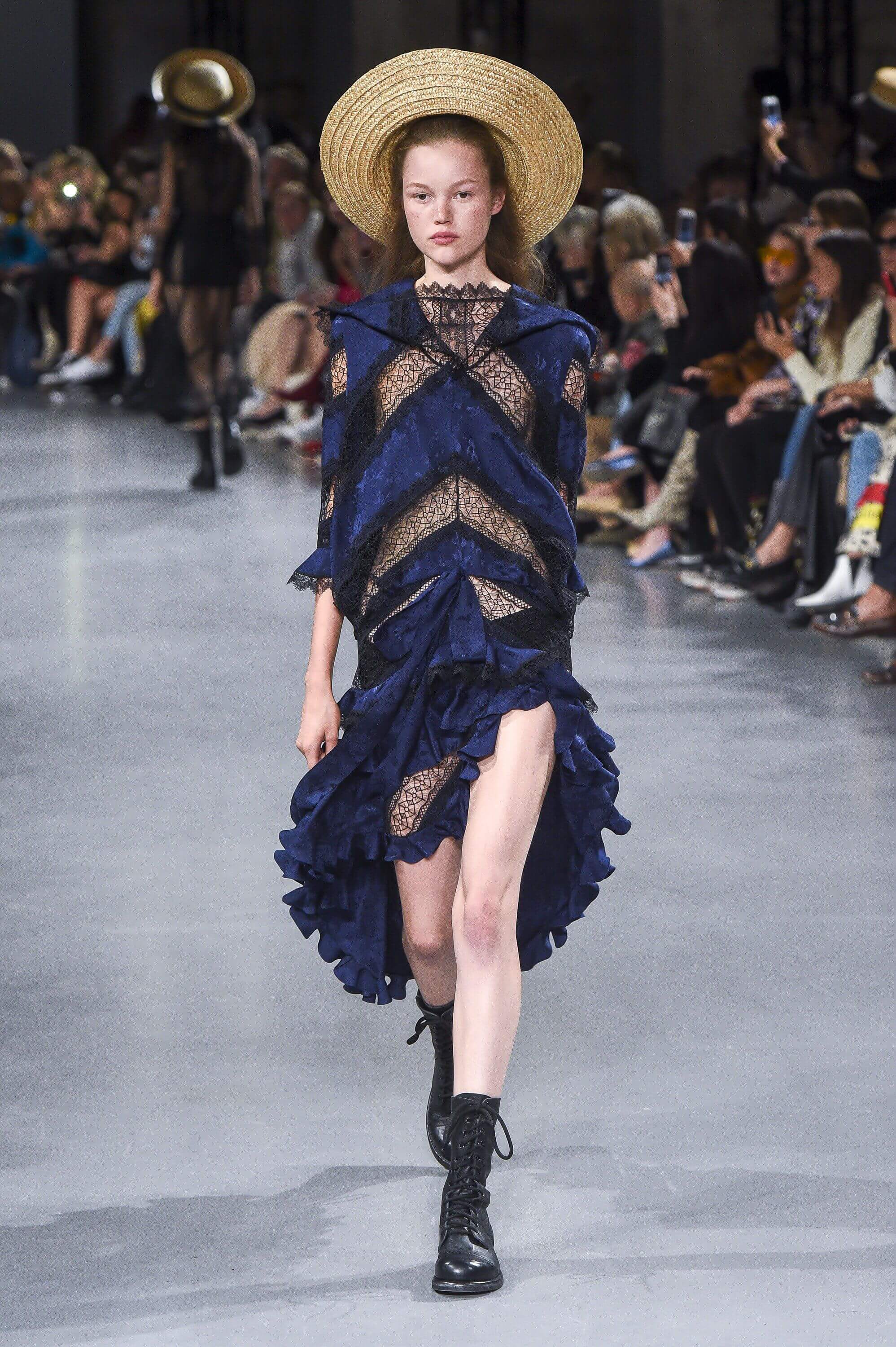 A picture of a model on the catwalk for Galliano SS 2019.