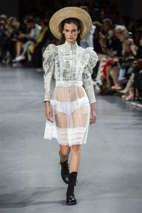 A picture of a model on the catwalk for Galliano SS 2019.