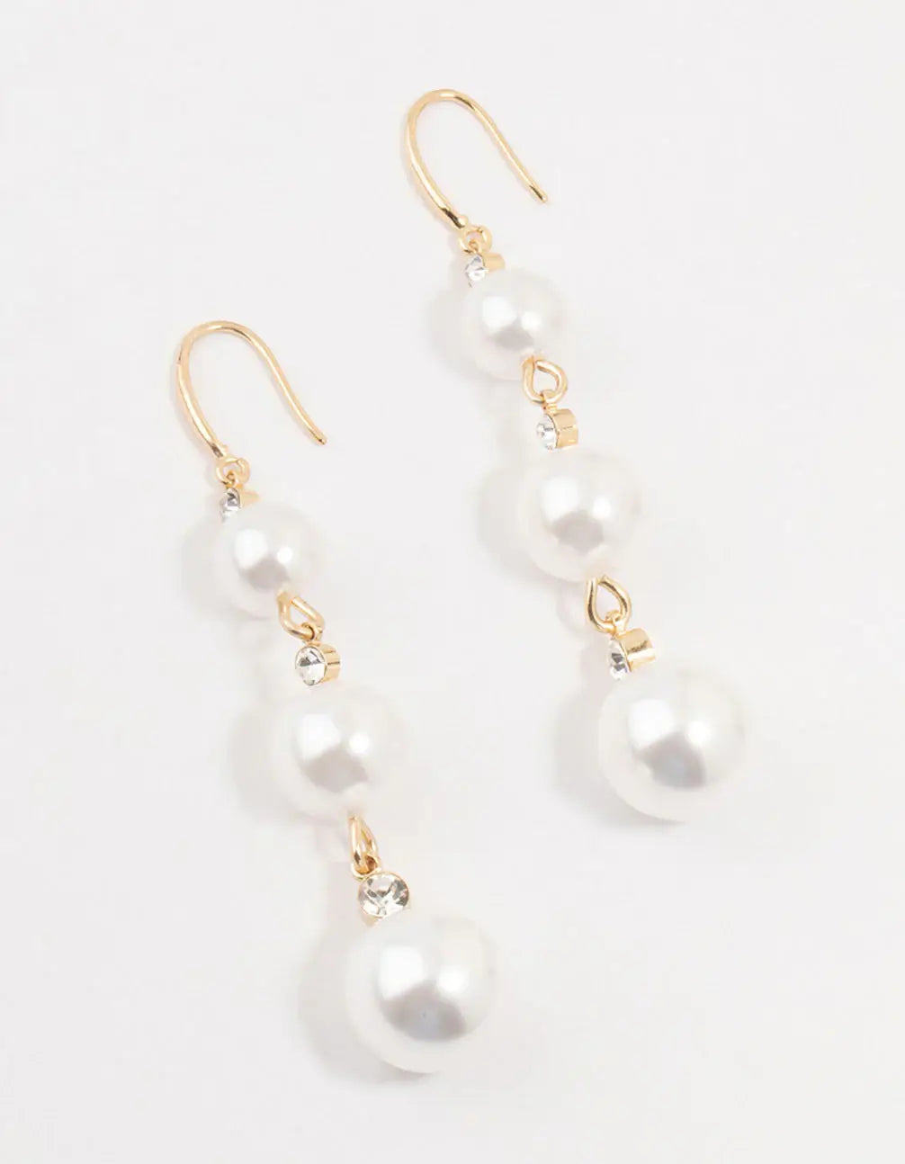 A picture of the Gold Diamante Pearl Drop Earrings, available at Lovisa