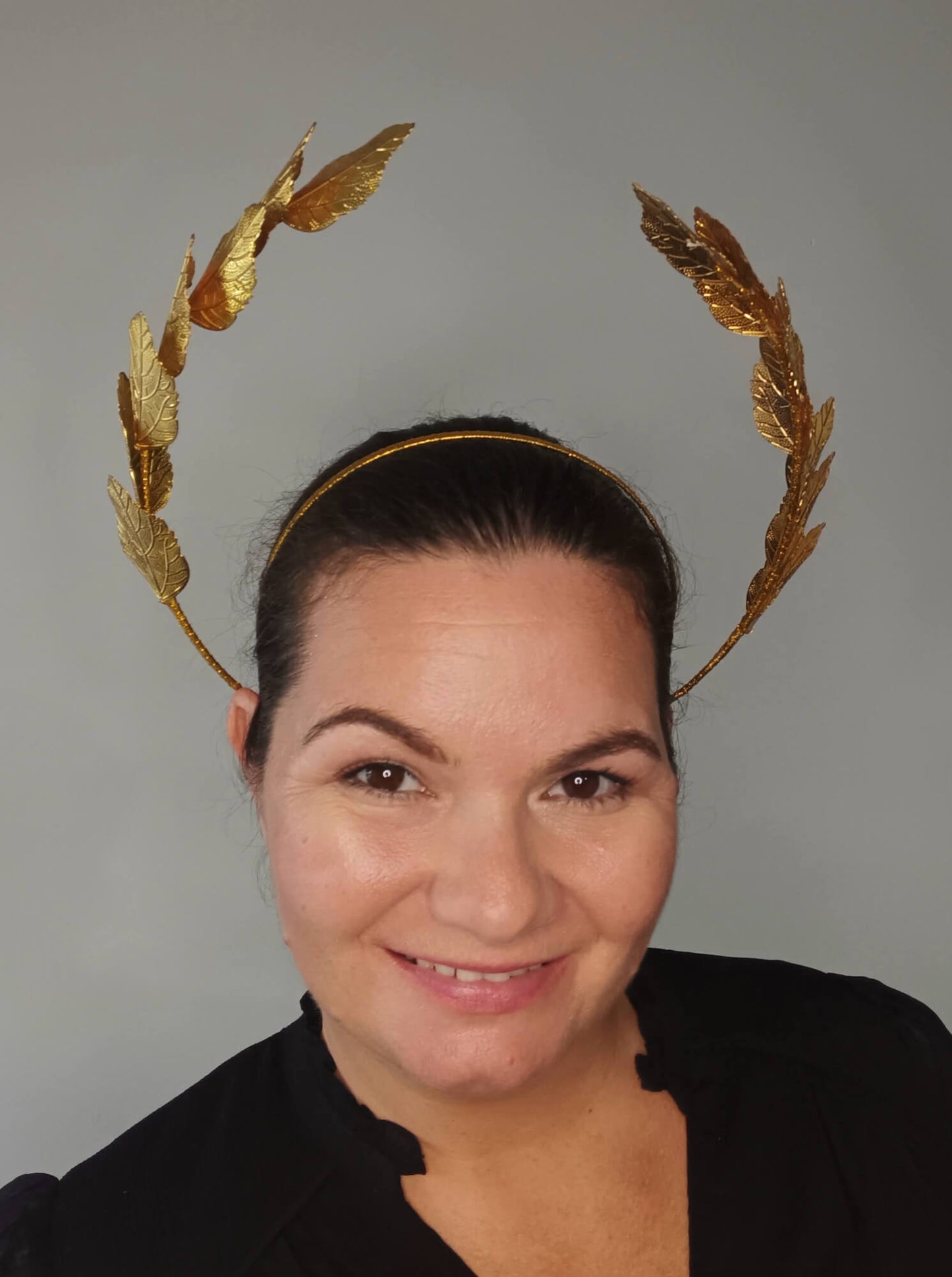 A picture of a Gold Leaf Millinery Headband by Melissa Rath Millinery