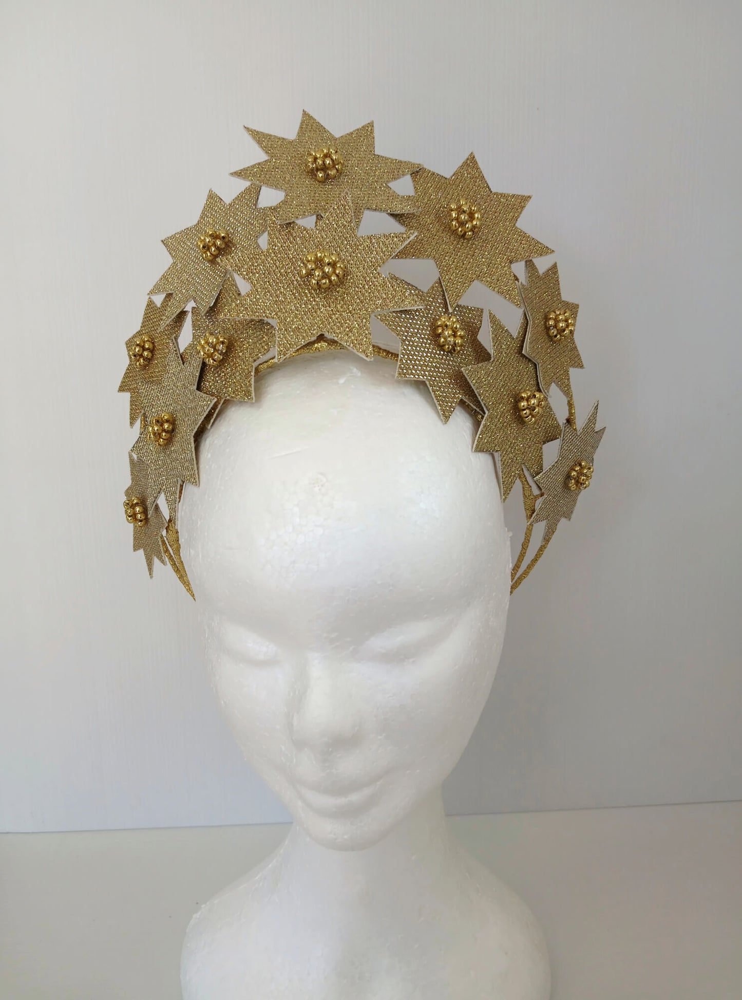 A picture of a Gold Pleather Millinery Crown by Melissa Rath Millinery.