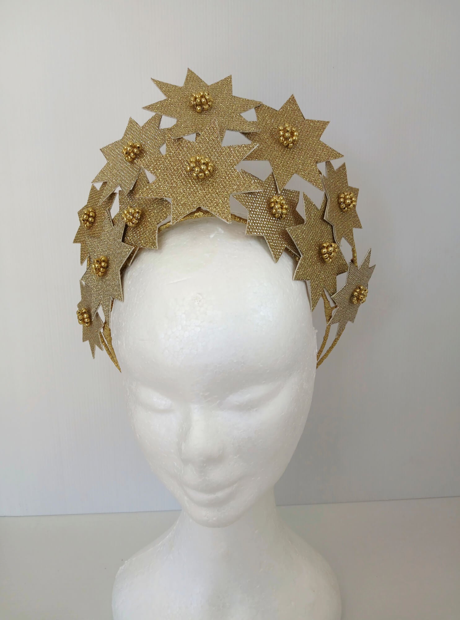 A picture of a Gold Pleather Millinery Crown by Melissa Rath Millinery.