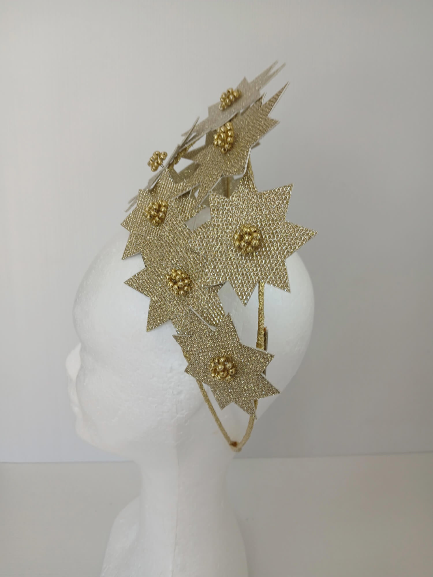 A picture of a Gold Pleather Millinery Crown by Melissa Rath Millinery.