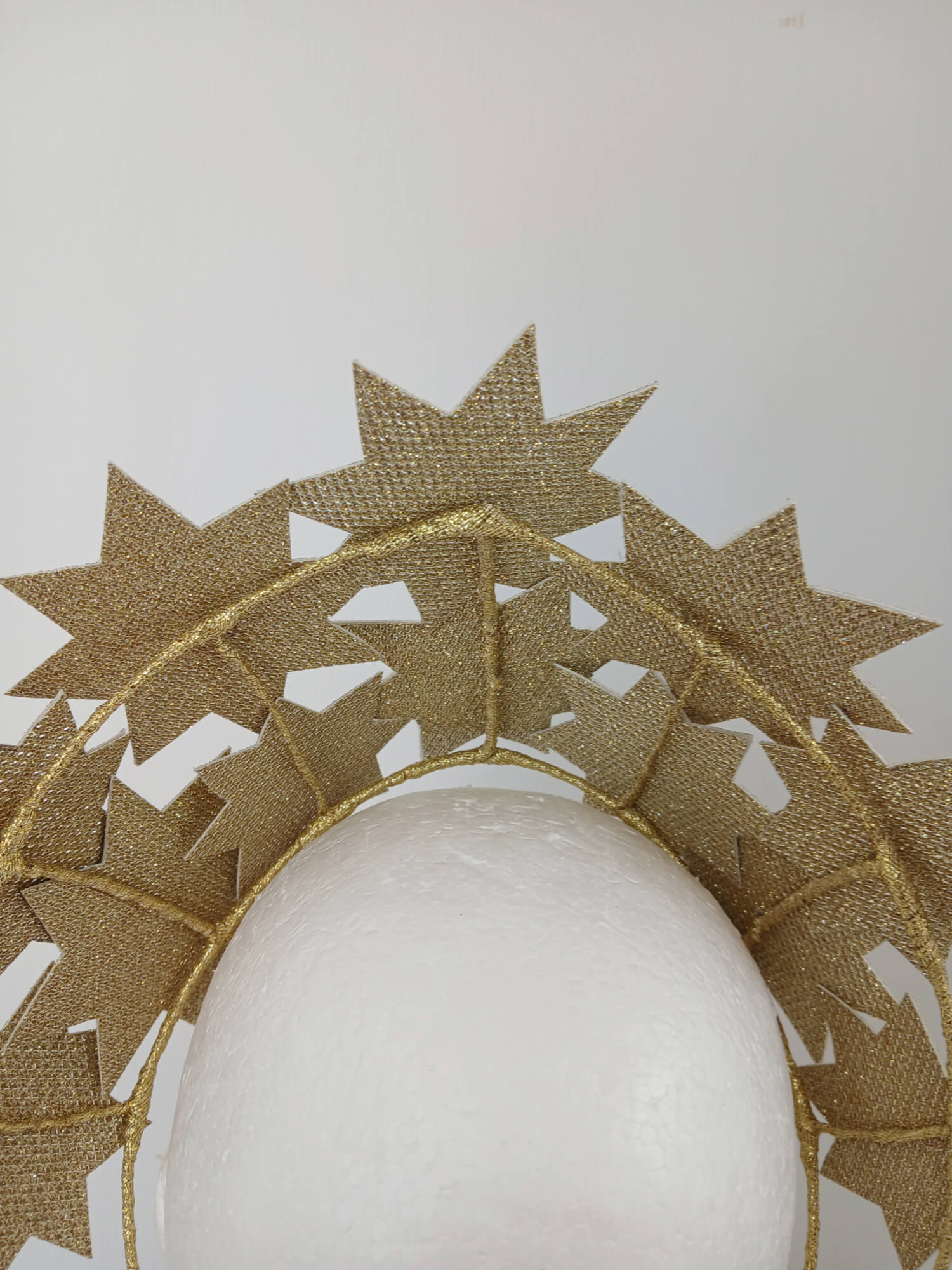 A picture of a Gold Pleather Millinery Crown by Melissa Rath Millinery.