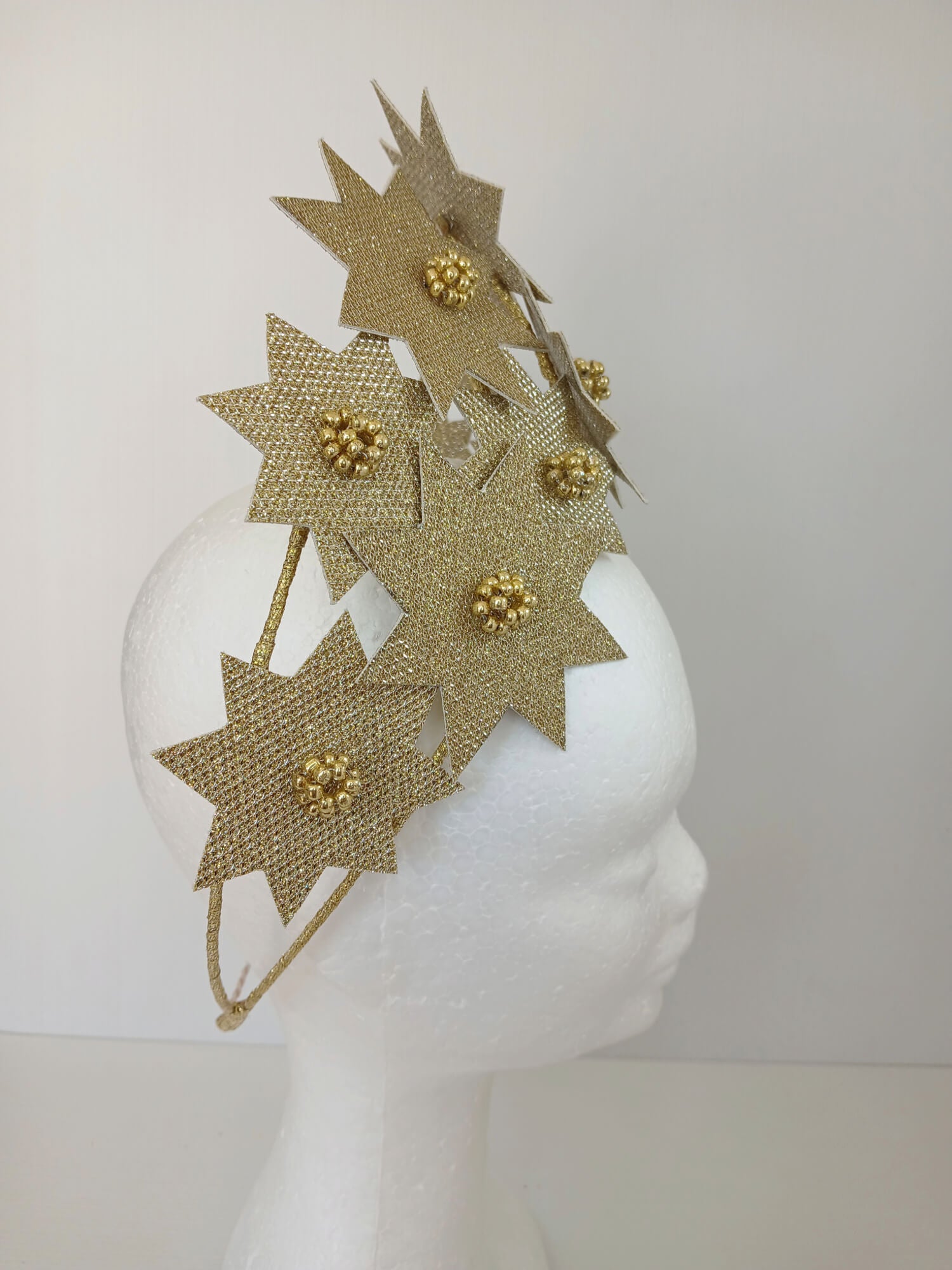 A picture of a Gold Pleather Millinery Crown by Melissa Rath Millinery.