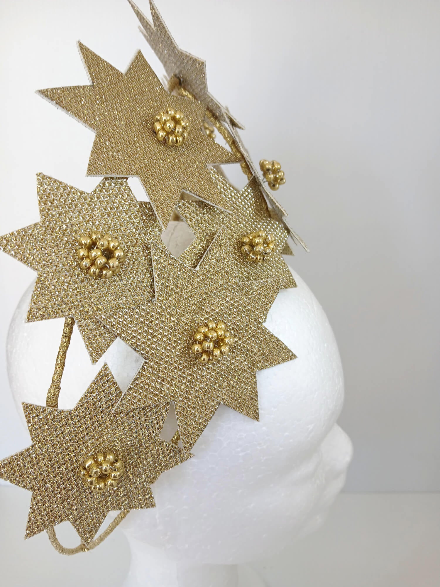A picture of a Gold Pleather Millinery Crown by Melissa Rath Millinery.