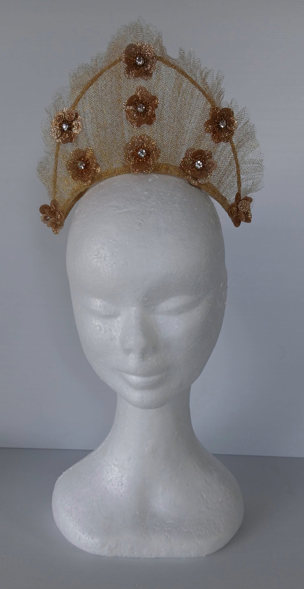 A picture of a Gold Tulle Crown by Melissa Rath Millinery