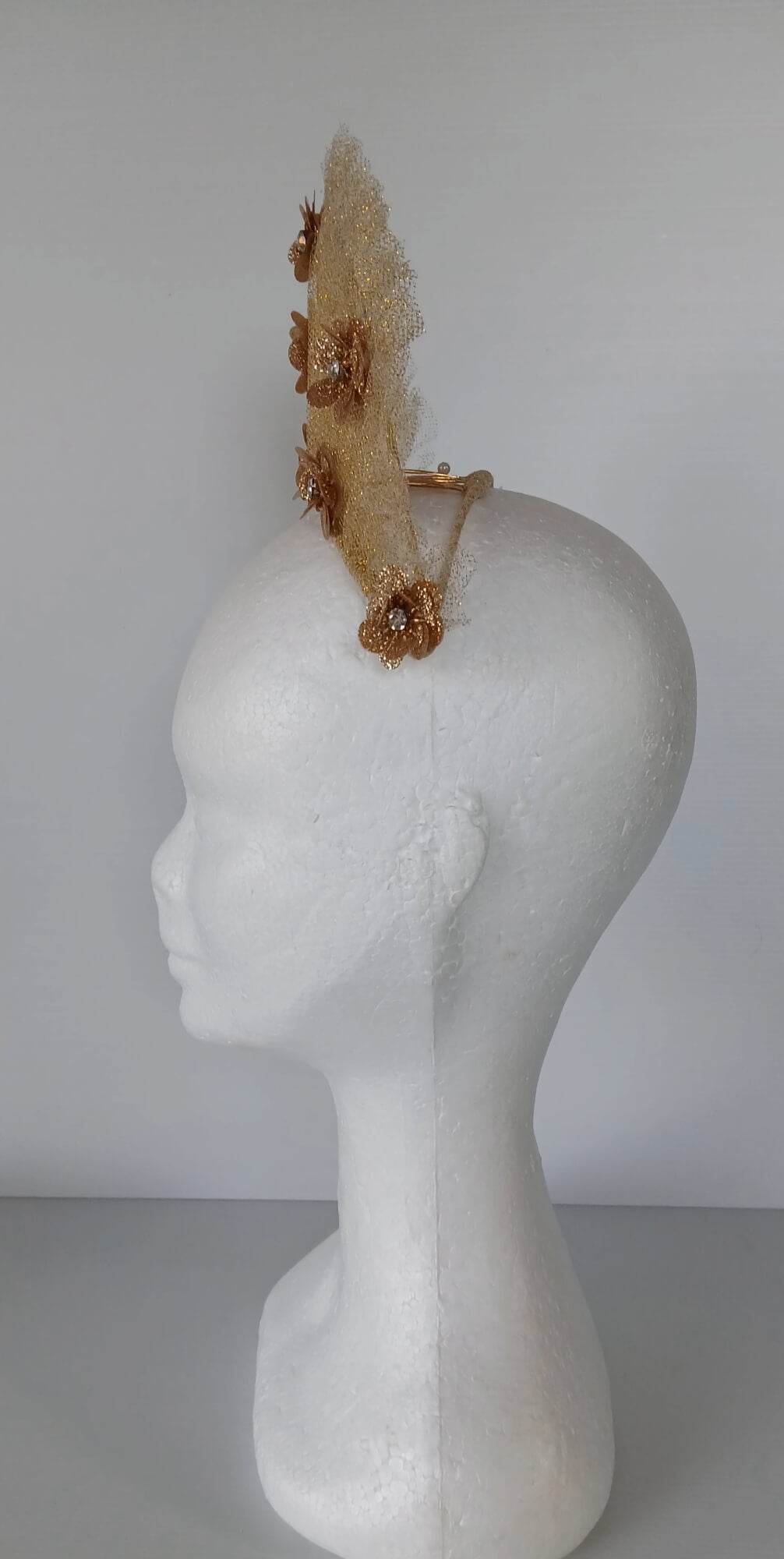 A picture of a Gold Tulle Crown by Melissa Rath Millinery