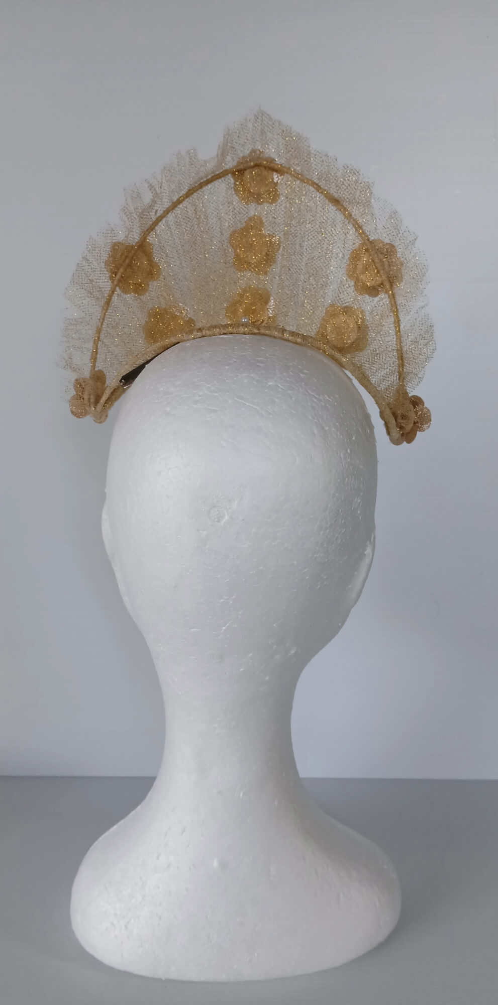 A picture of a Gold Tulle Crown by Melissa Rath Millinery