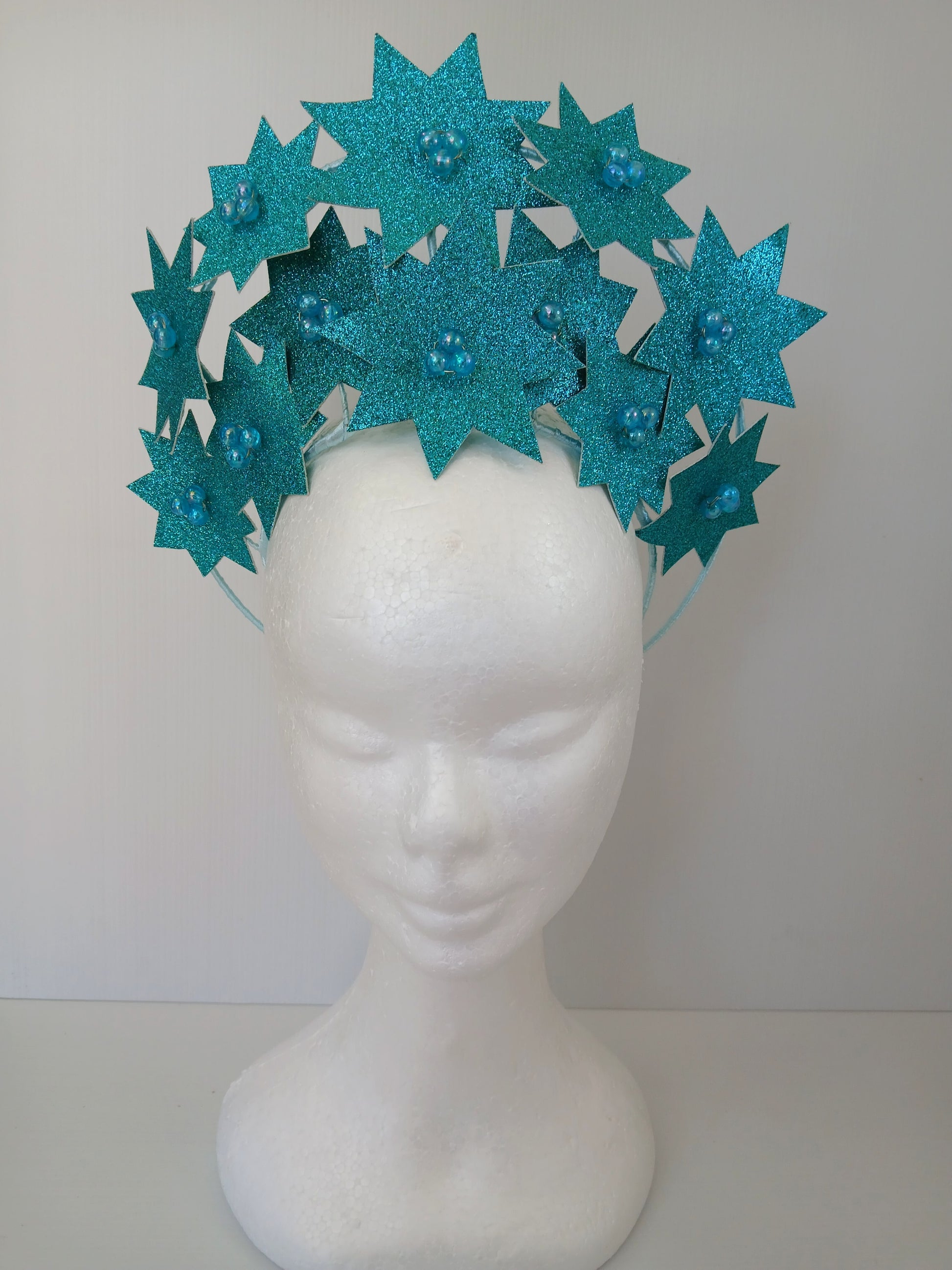 A picture of a Green Pleather Millinery Crown by Melissa Rath Millinery