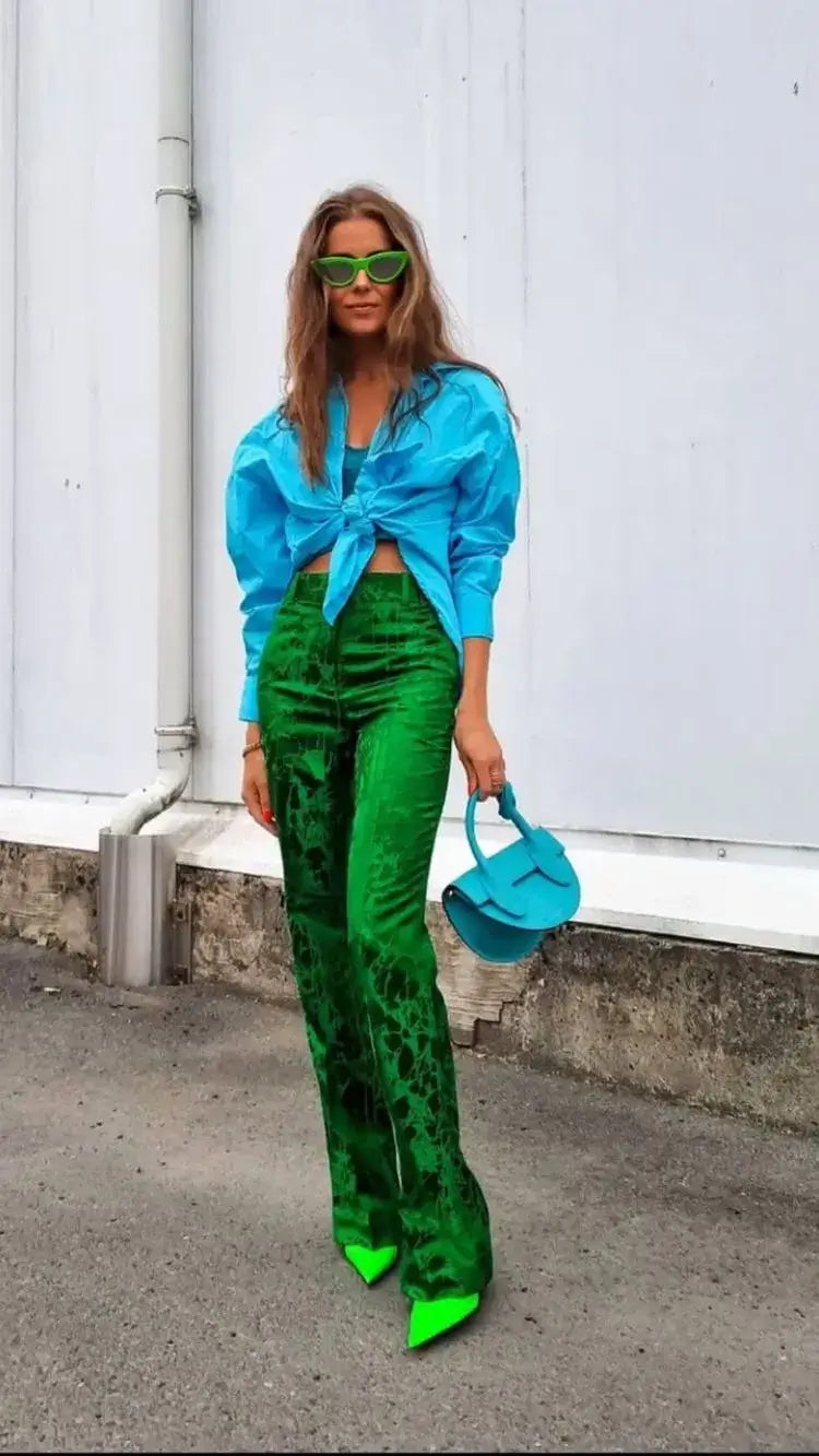 A picture of a woman wearing an outfit in a green analogous colour scheme.