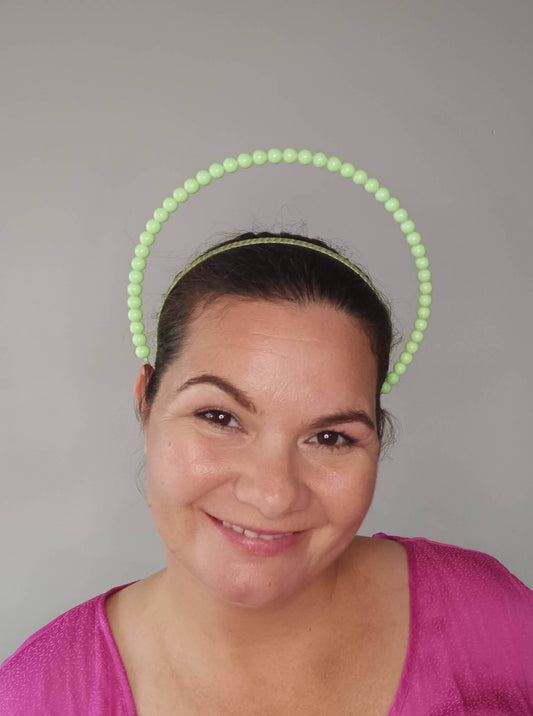 A picture of a Green Beaded Headband by Melissa Rath Millinery