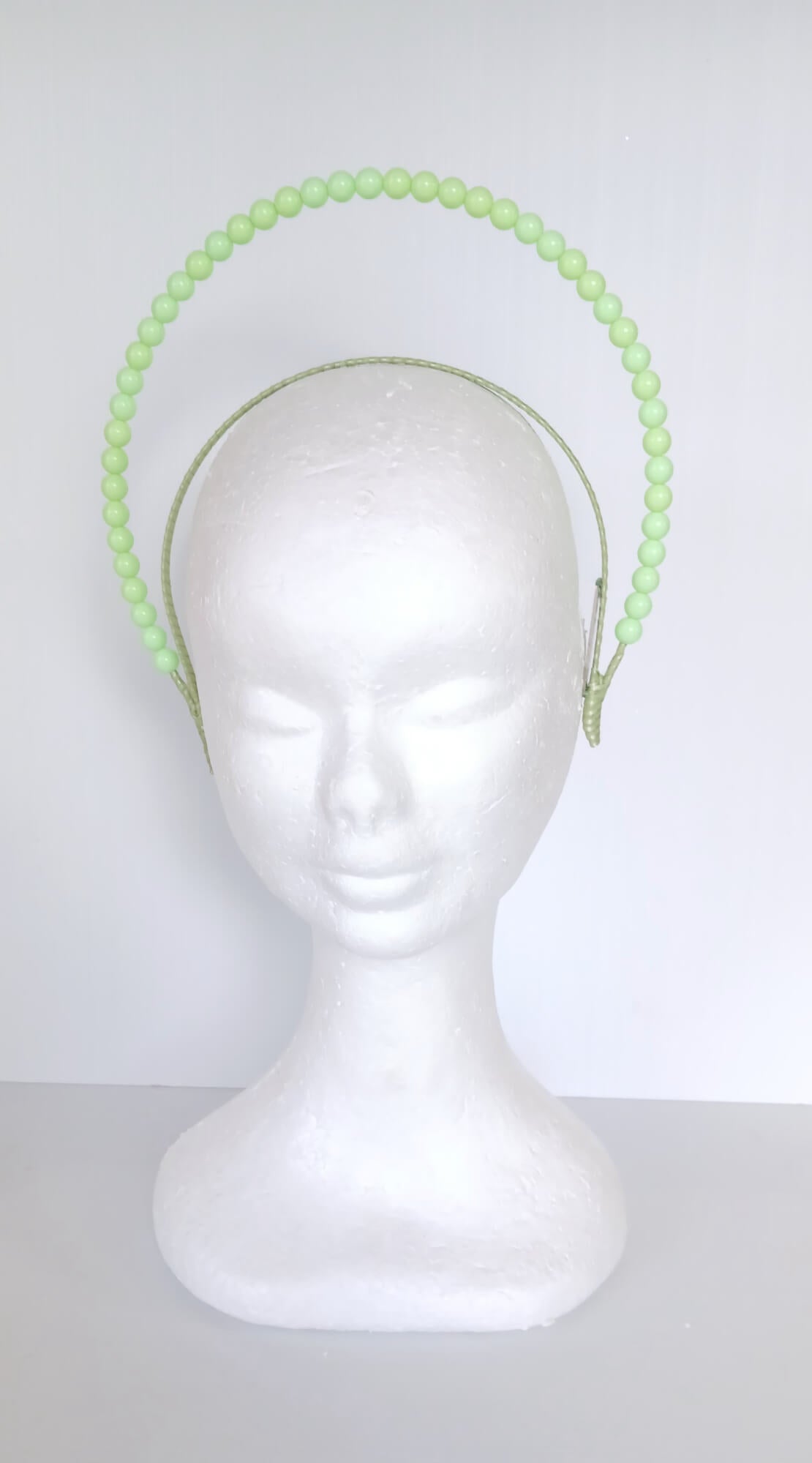 A picture of a Green Beaded Headband by Melissa Rath Millinery