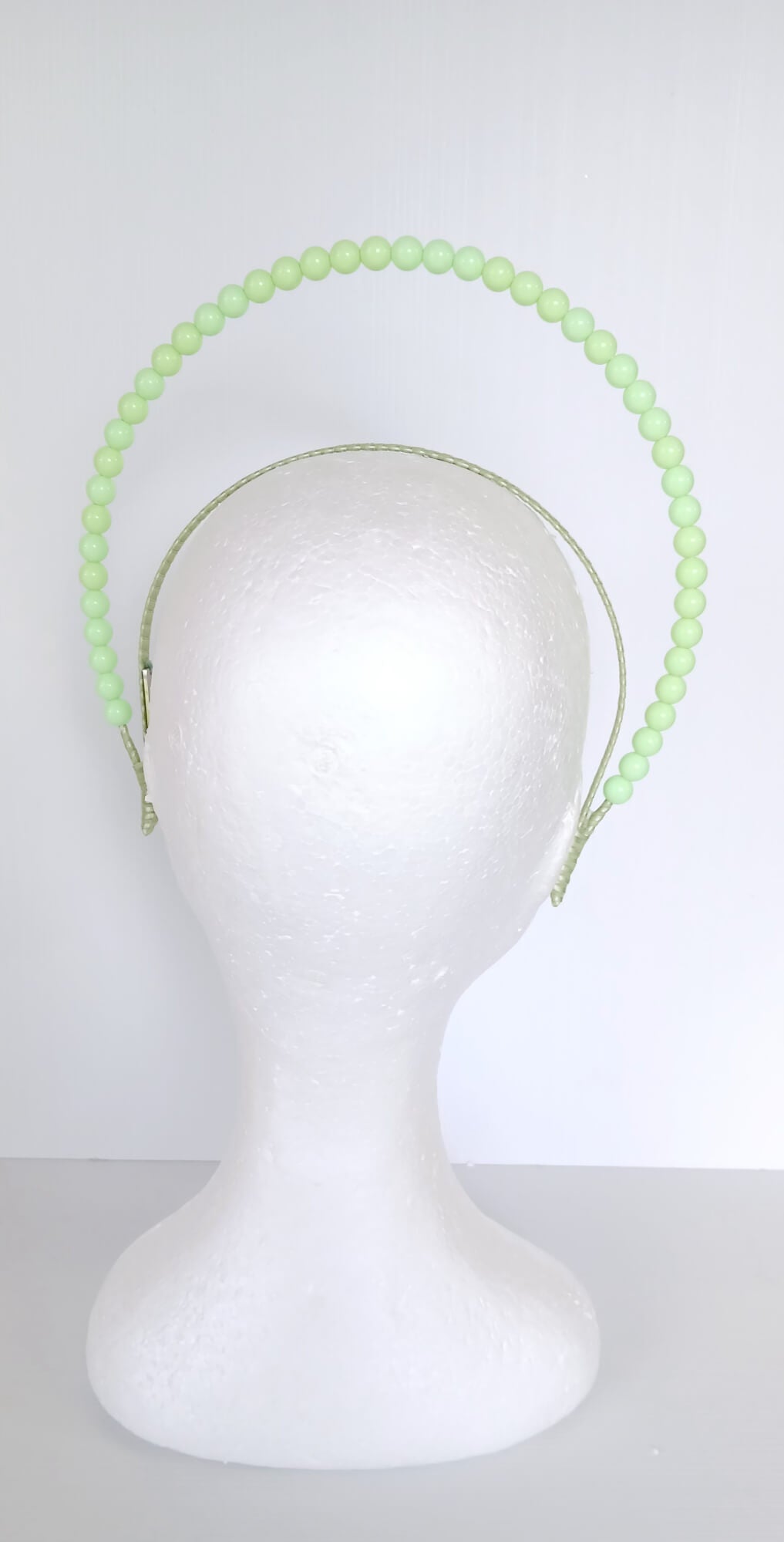 A picture of a Green Beaded Headband by Melissa Rath Millinery