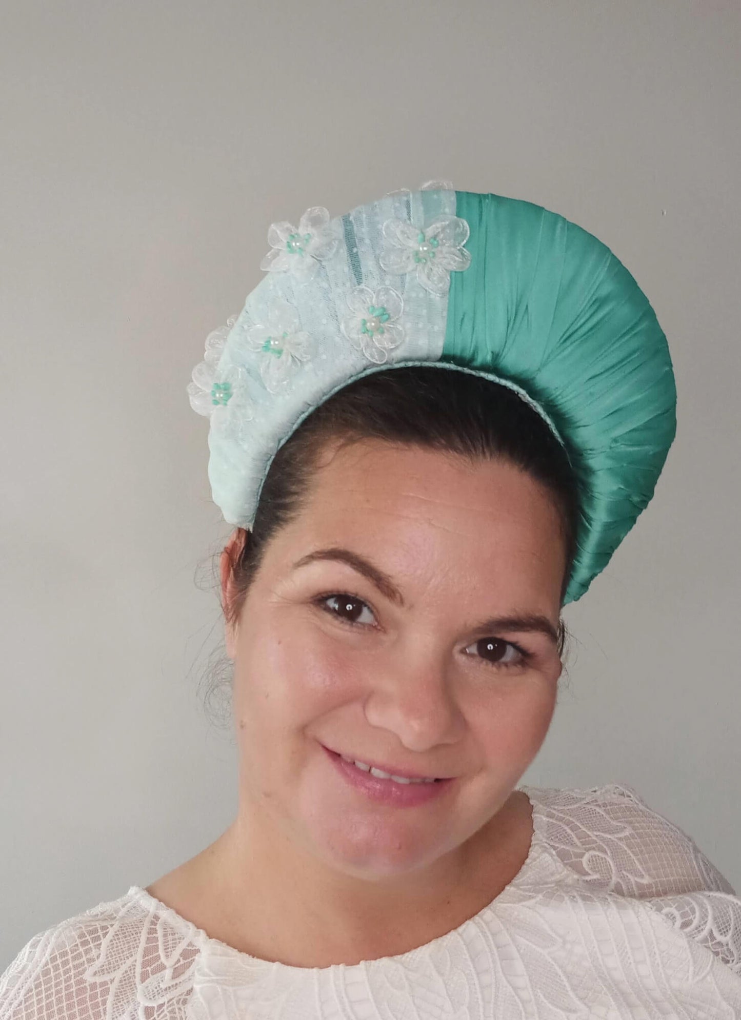 A picture of a Green Blocked Millinery Crown by Melissa Rath Millinery.