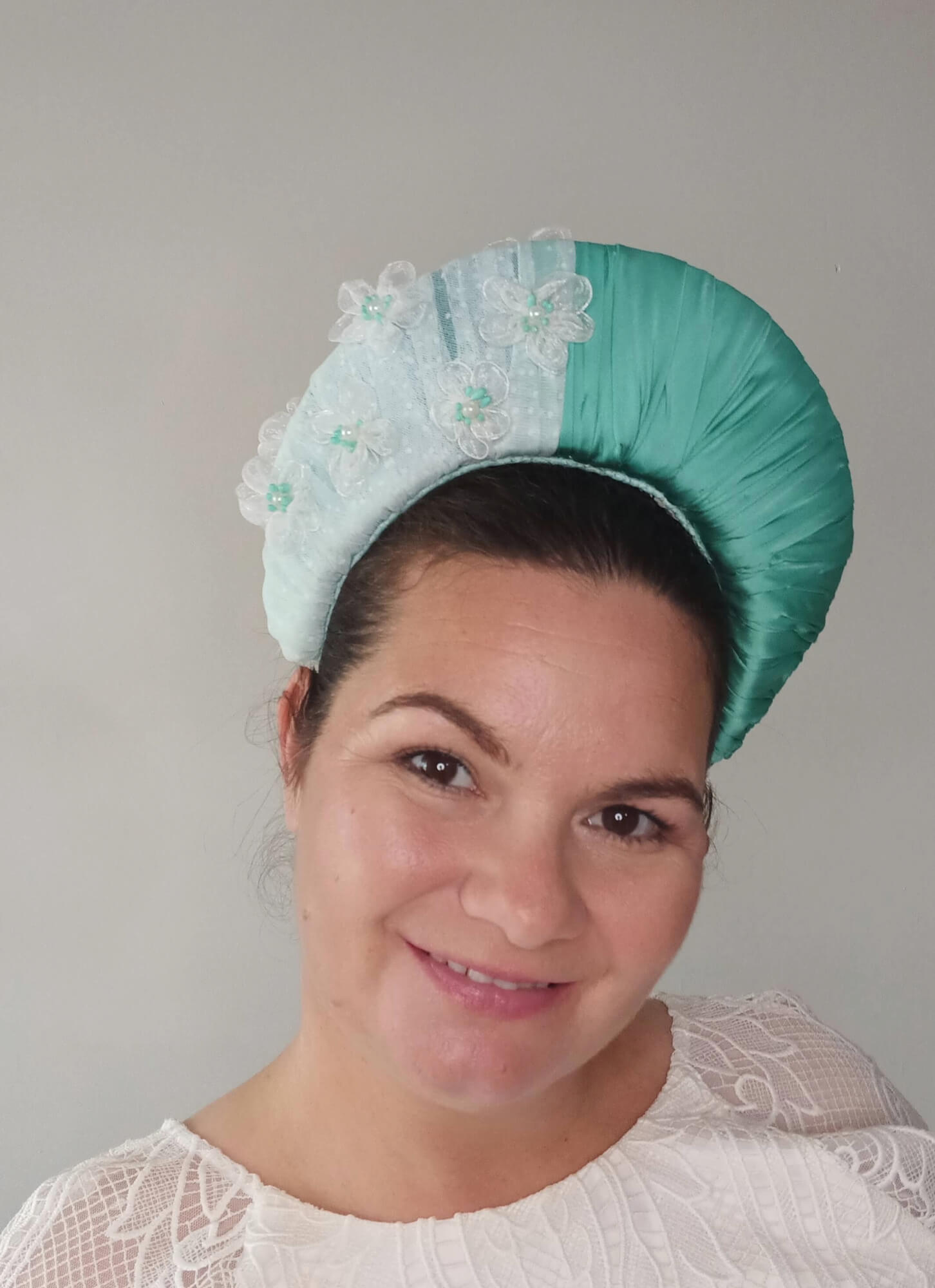 A picture of a Green Blocked Millinery Crown by Melissa Rath Millinery.