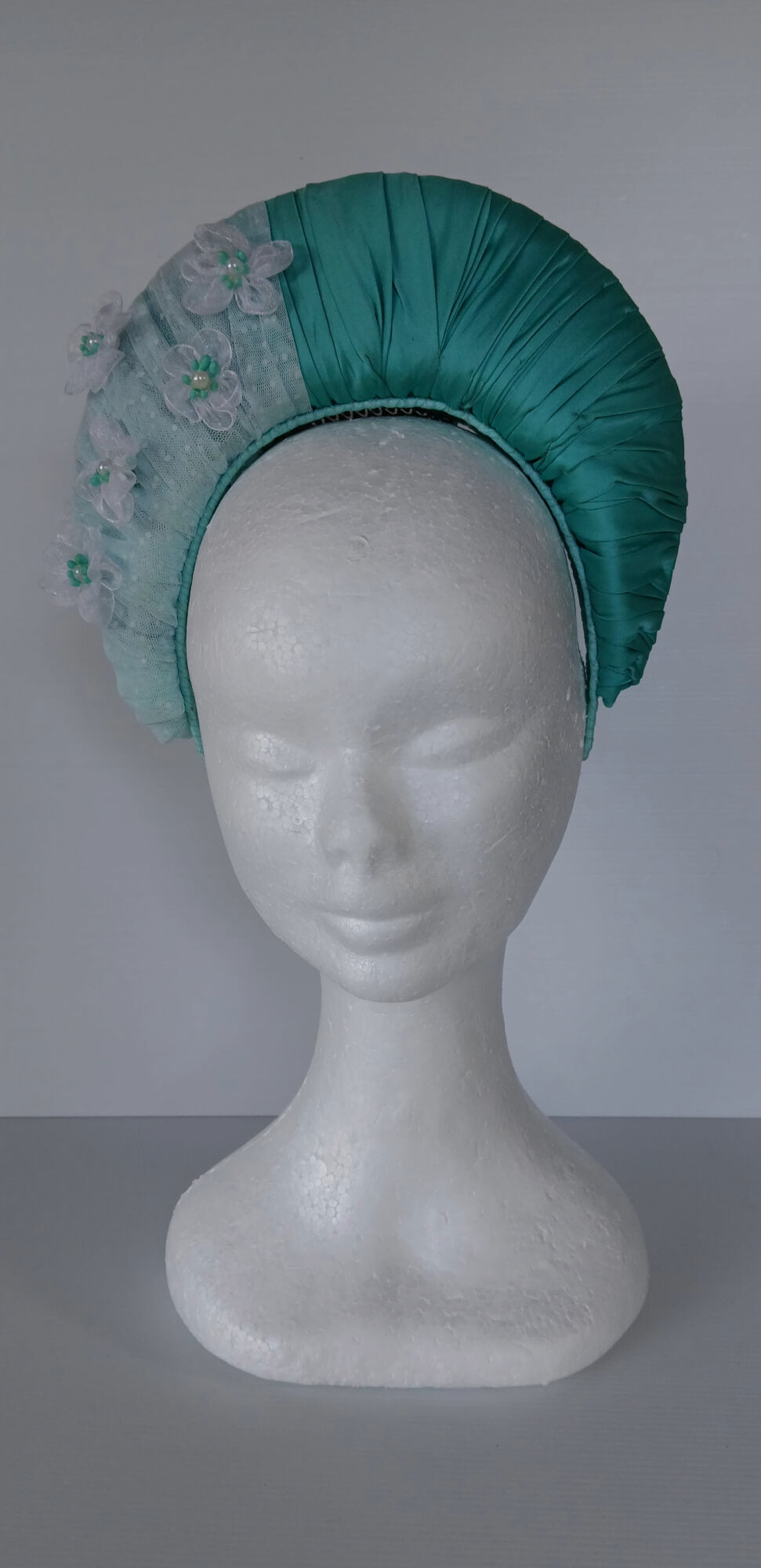 A picture of a Green Blocked Millinery Crown by Melissa Rath Millinery.