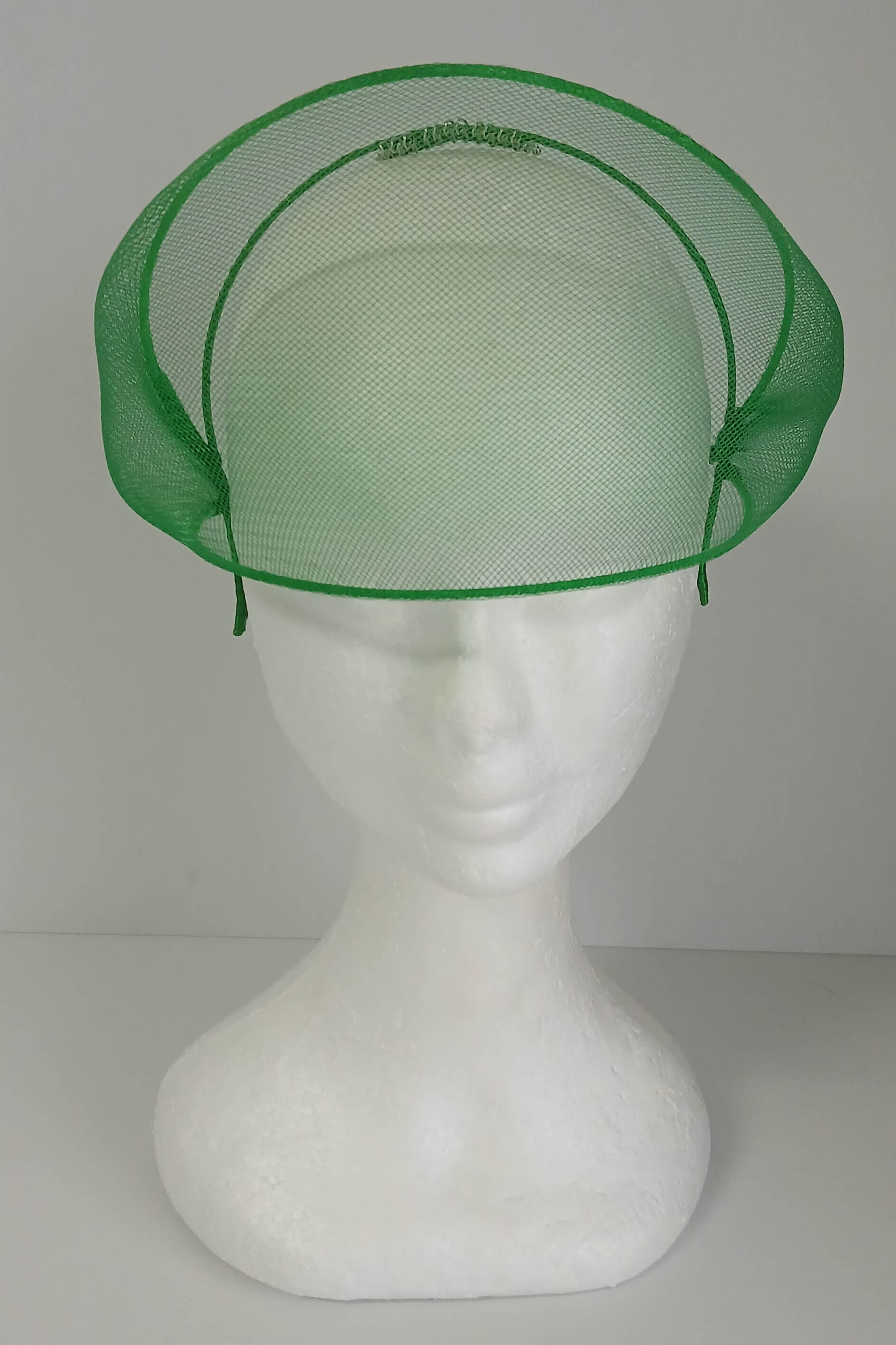 A picture of a green crinoline millinery crown by Melissa Rath Millinery
