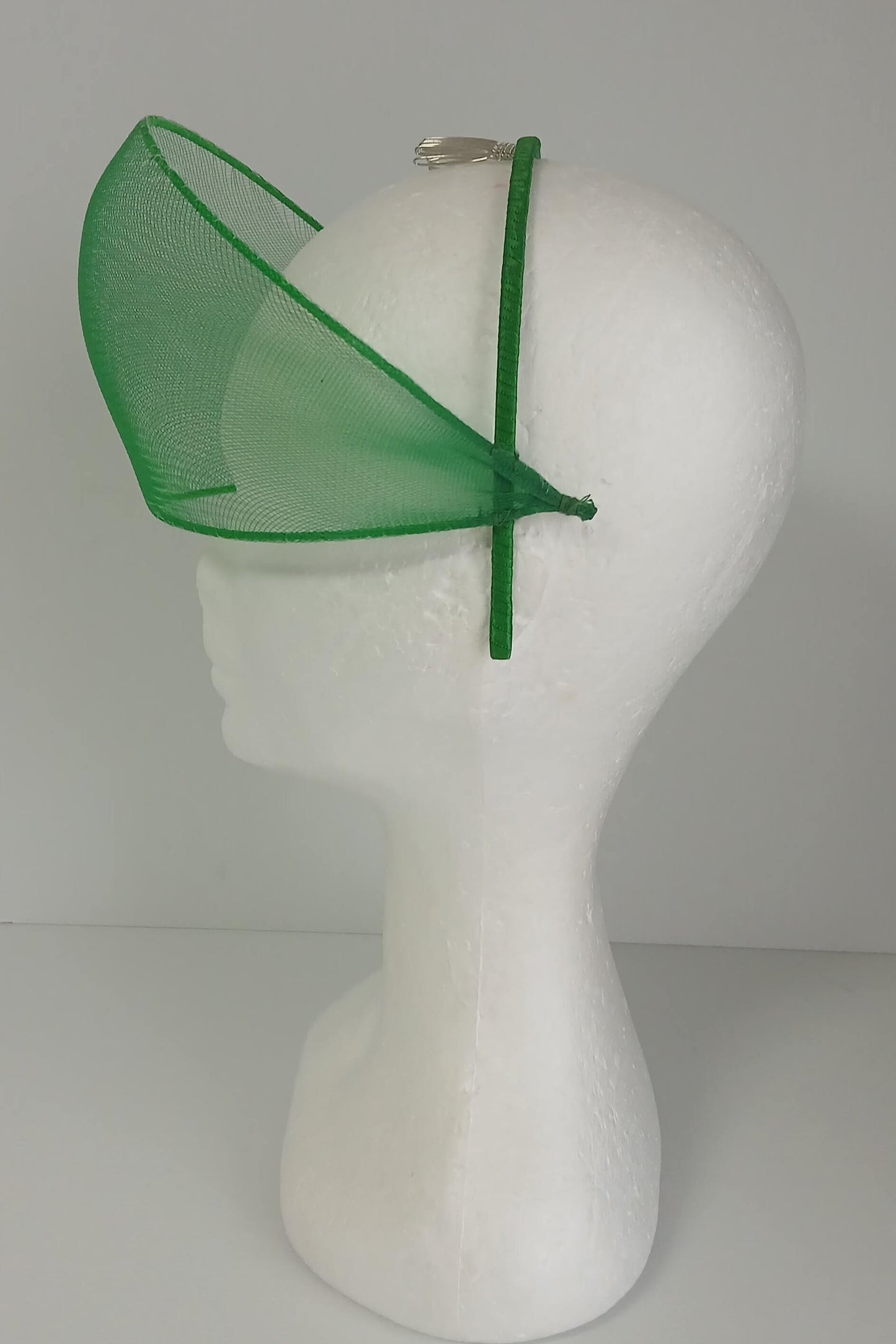 A picture of a green crinoline millinery crown by Melissa Rath Millinery